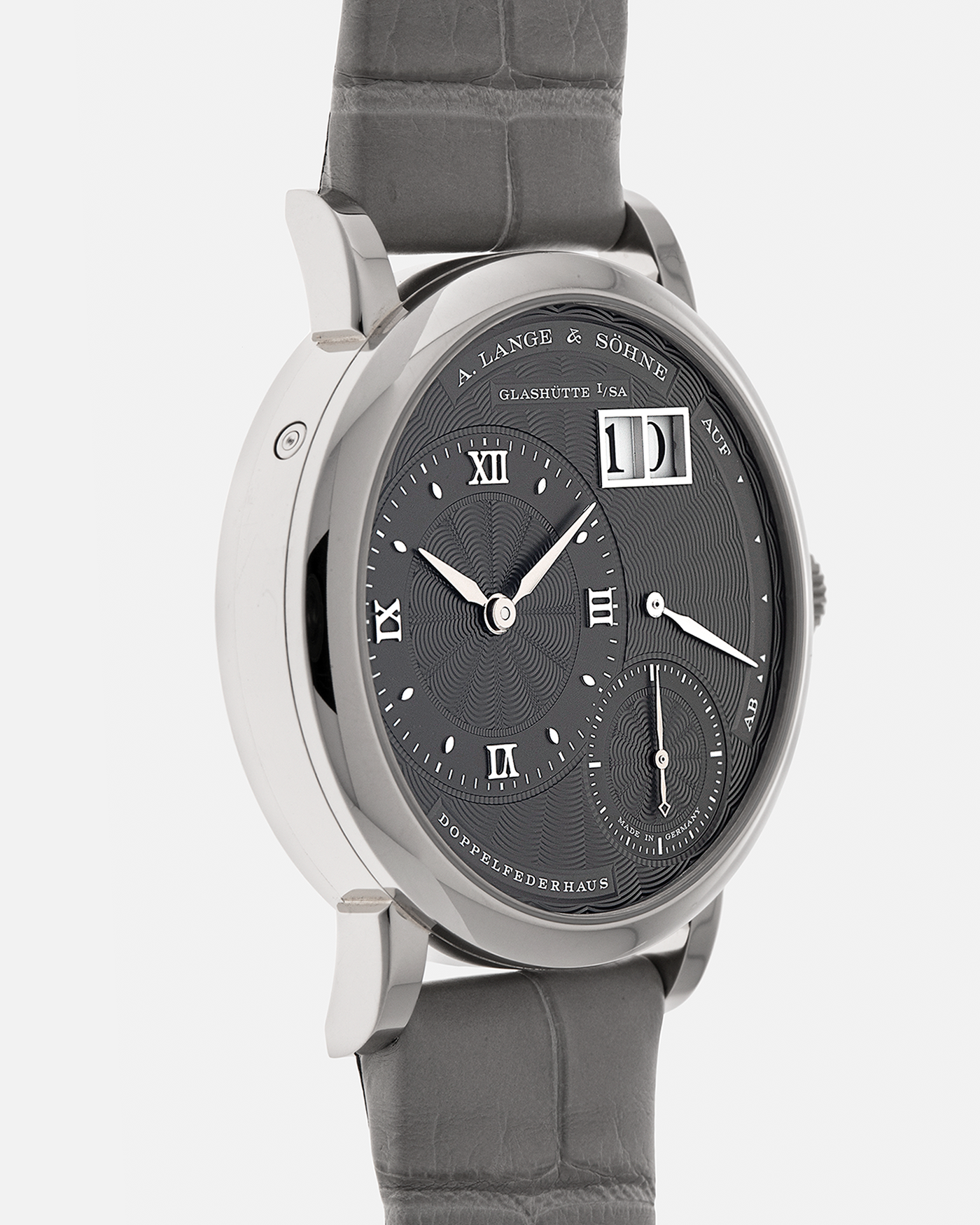 Brand: A. Lange & Söhne
Year: 2021
Model: Little Lange 1 
Reference Number: 181.038
Material: 18-carat White Gold
Movement: A. Lange & Söhne Cal. L121.1, Manual Winding
Case Dimensions: 36.8mm x 9.5mm (Lug-to-Lug 44mm)
Lug Width: 19mm
Strap: A. Lange & Söhne Light Grey Unstitched Alligator Strap with Signed 18-carat White Gold Tang Buckle