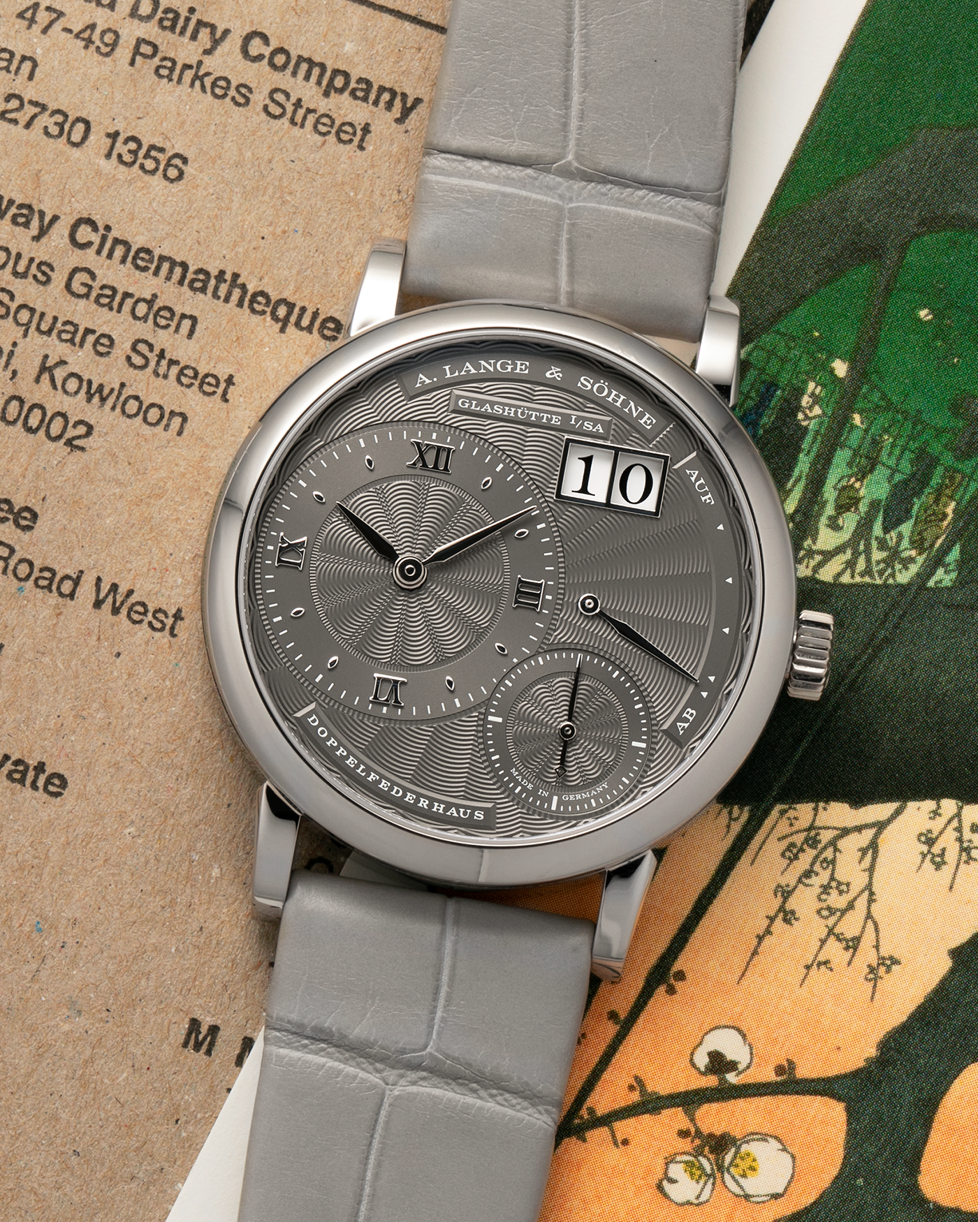 Brand: A. Lange & Söhne
Year: 2021
Model: Little Lange 1 
Reference Number: 181.038
Material: 18-carat White Gold
Movement: A. Lange & Söhne Cal. L121.1, Manual Winding
Case Dimensions: 36.8mm x 9.5mm (Lug-to-Lug 44mm)
Lug Width: 19mm
Strap: A. Lange & Söhne Light Grey Unstitched Alligator Strap with Signed 18-carat White Gold Tang Buckle