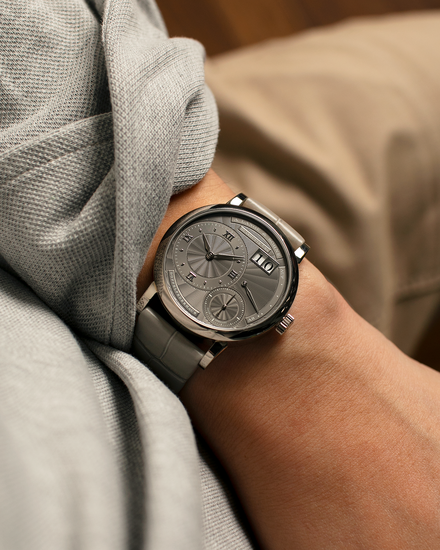 Brand: A. Lange & Söhne
Year: 2021
Model: Little Lange 1 
Reference Number: 181.038
Material: 18-carat White Gold
Movement: A. Lange & Söhne Cal. L121.1, Manual Winding
Case Dimensions: 36.8mm x 9.5mm (Lug-to-Lug 44mm)
Lug Width: 19mm
Strap: A. Lange & Söhne Light Grey Unstitched Alligator Strap with Signed 18-carat White Gold Tang Buckle