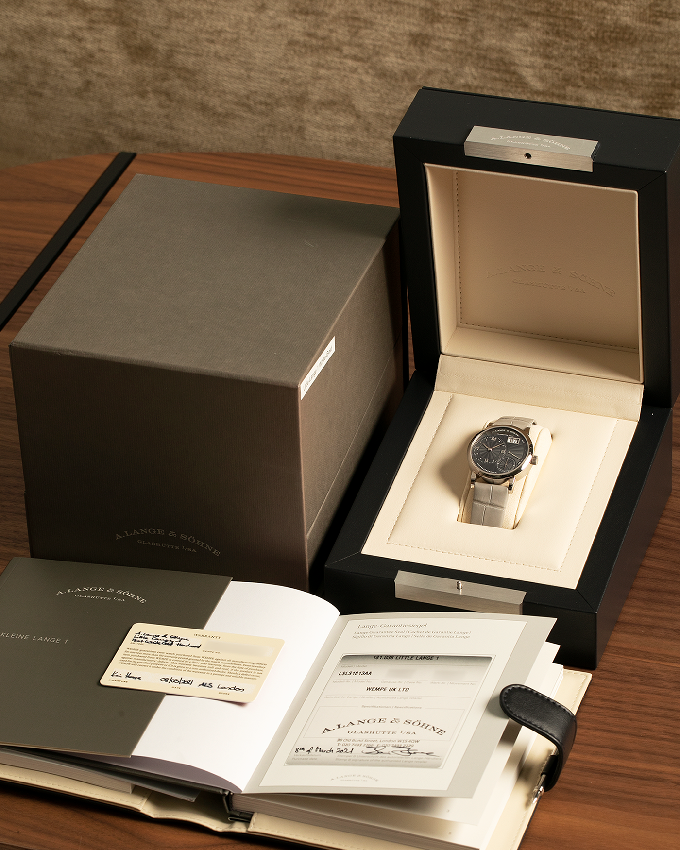Brand: A. Lange & Söhne
Year: 2021
Model: Little Lange 1 
Reference Number: 181.038
Material: 18-carat White Gold
Movement: A. Lange & Söhne Cal. L121.1, Manual Winding
Case Dimensions: 36.8mm x 9.5mm (Lug-to-Lug 44mm)
Lug Width: 19mm
Strap: A. Lange & Söhne Light Grey Unstitched Alligator Strap with Signed 18-carat White Gold Tang Buckle