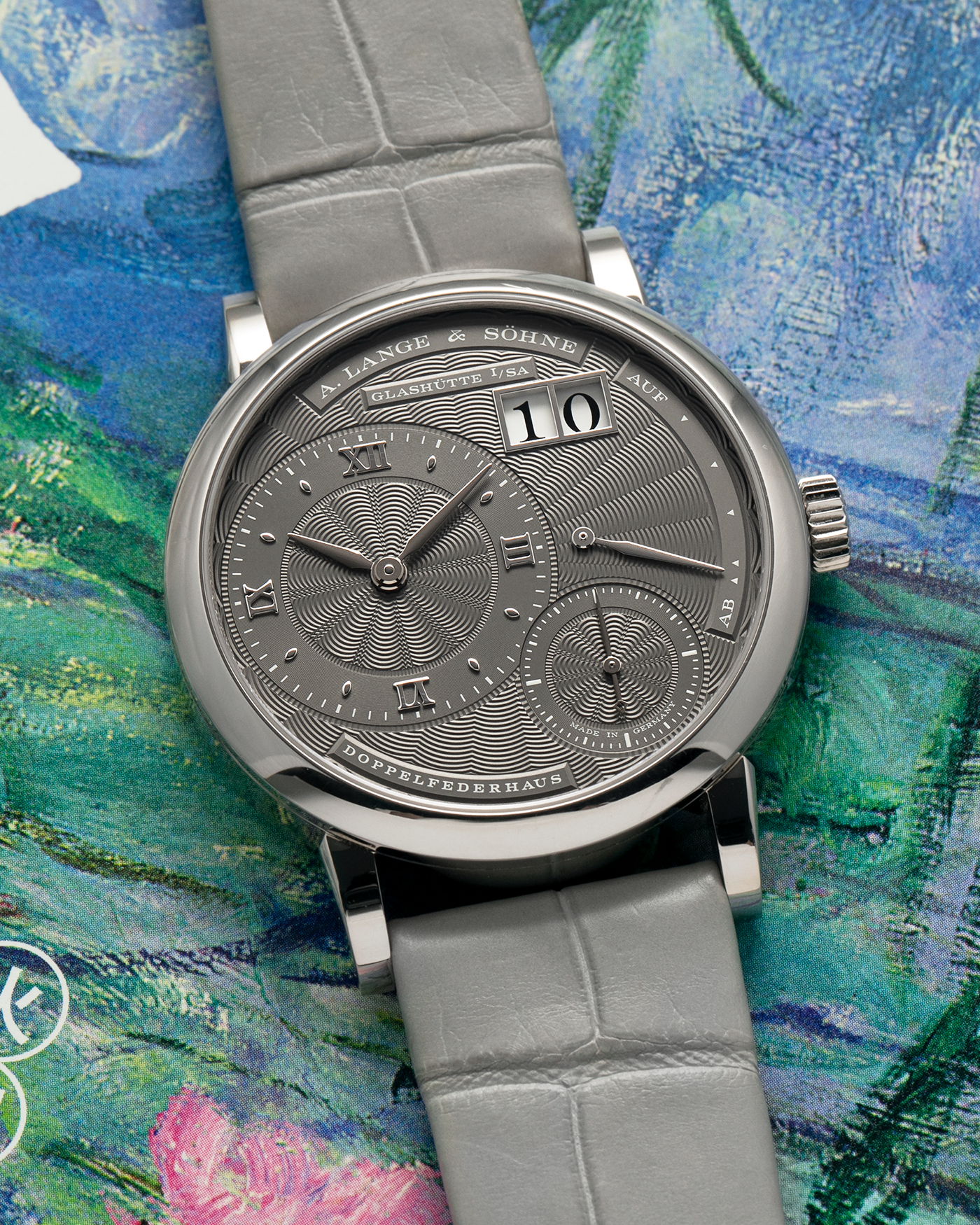 Brand: A. Lange & Söhne
Year: 2021
Model: Little Lange 1 
Reference Number: 181.038
Material: 18-carat White Gold
Movement: A. Lange & Söhne Cal. L121.1, Manual Winding
Case Dimensions: 36.8mm x 9.5mm (Lug-to-Lug 44mm)
Lug Width: 19mm
Strap: A. Lange & Söhne Light Grey Unstitched Alligator Strap with Signed 18-carat White Gold Tang Buckle