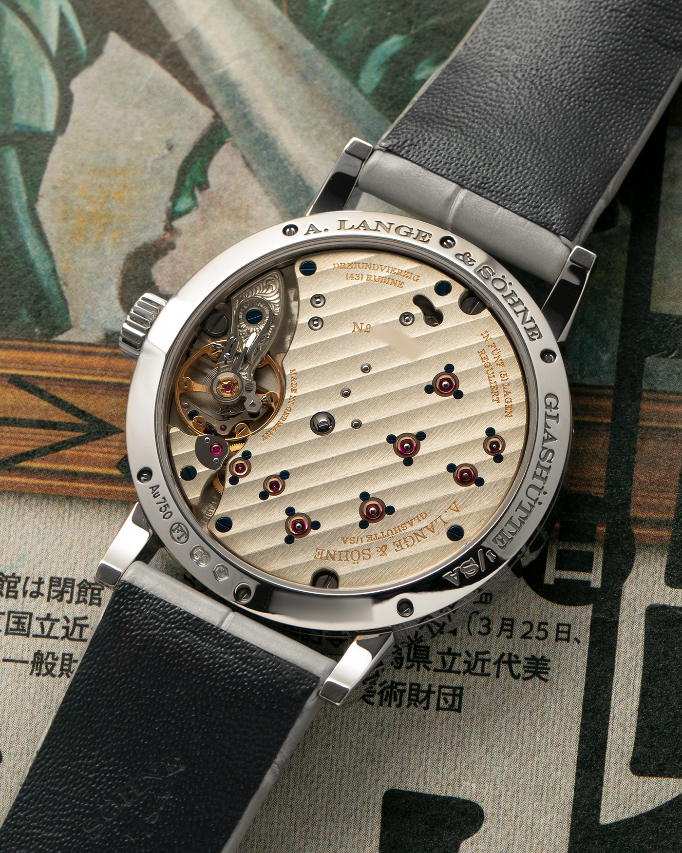 Brand: A. Lange & Söhne
Year: 2021
Model: Little Lange 1 
Reference Number: 181.038
Material: 18-carat White Gold
Movement: A. Lange & Söhne Cal. L121.1, Manual Winding
Case Dimensions: 36.8mm x 9.5mm (Lug-to-Lug 44mm)
Lug Width: 19mm
Strap: A. Lange & Söhne Light Grey Unstitched Alligator Strap with Signed 18-carat White Gold Tang Buckle