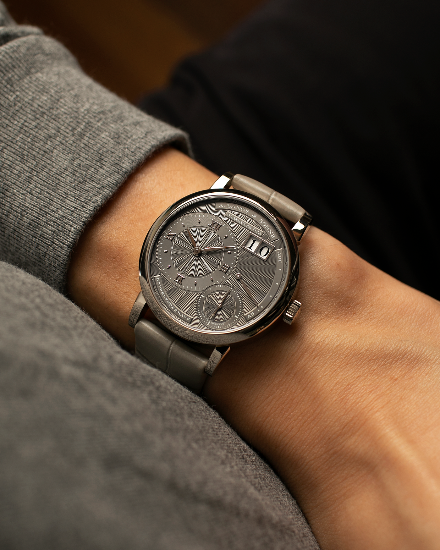 Brand: A. Lange & Söhne
Year: 2021
Model: Little Lange 1 
Reference Number: 181.038
Material: 18-carat White Gold
Movement: A. Lange & Söhne Cal. L121.1, Manual Winding
Case Dimensions: 36.8mm x 9.5mm (Lug-to-Lug 44mm)
Lug Width: 19mm
Strap: A. Lange & Söhne Light Grey Unstitched Alligator Strap with Signed 18-carat White Gold Tang Buckle
