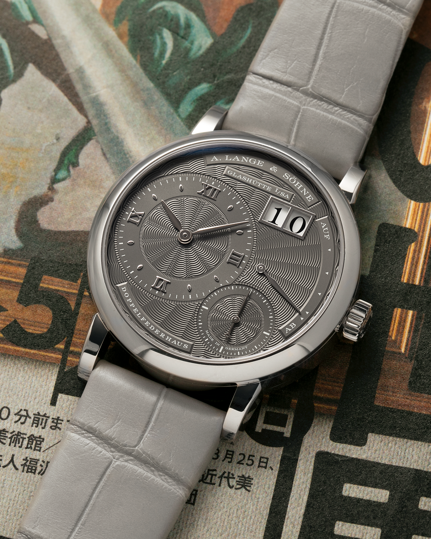 Brand: A. Lange & Söhne
Year: 2021
Model: Little Lange 1 
Reference Number: 181.038
Material: 18-carat White Gold
Movement: A. Lange & Söhne Cal. L121.1, Manual Winding
Case Dimensions: 36.8mm x 9.5mm (Lug-to-Lug 44mm)
Lug Width: 19mm
Strap: A. Lange & Söhne Light Grey Unstitched Alligator Strap with Signed 18-carat White Gold Tang Buckle