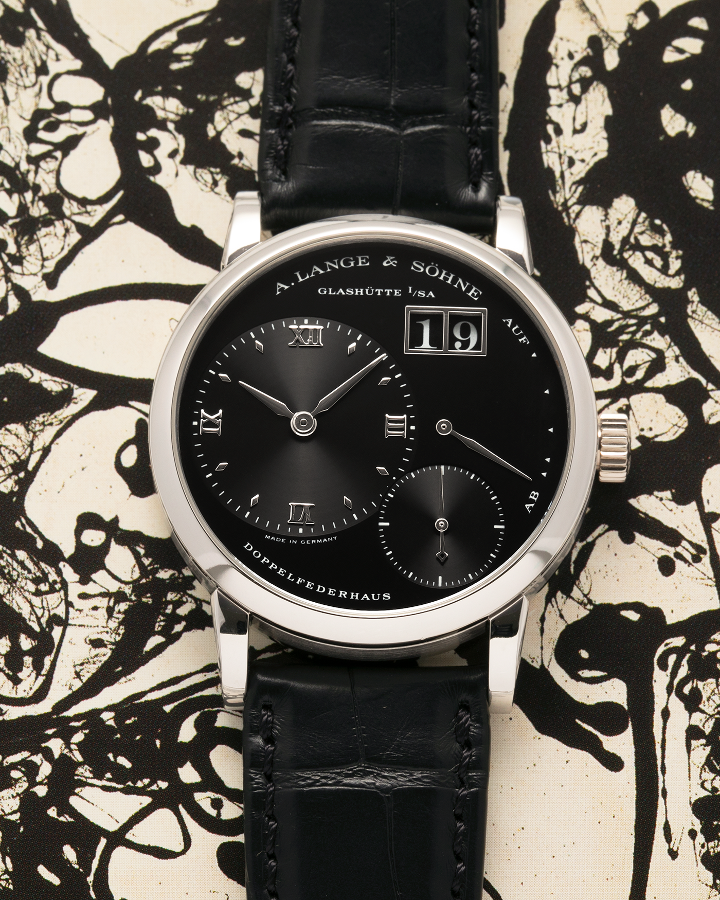 Brand: A. Lange & Söhne
Year: 2005
Model: Little Lange 1 ‘Darth’
Reference: 111.035
Material: Platinum 950
Movement: A. Lange & Söhne Cal. L901.0, Manual Winding
Case Dimensions: 36mm x 10mm (Lug-to-Lug 43mm)
Lug Width: 19mm
Strap: A. Lange & Söhne Black Alligator Leather Strap with Signed Platinum 950 Tang Buckle