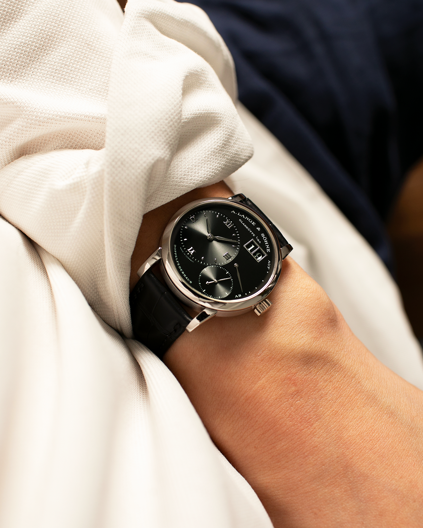 Brand: A. Lange & Söhne
Year: 2005
Model: Little Lange 1 ‘Darth’
Reference: 111.035
Material: Platinum 950
Movement: A. Lange & Söhne Cal. L901.0, Manual Winding
Case Dimensions: 36mm x 10mm (Lug-to-Lug 43mm)
Lug Width: 19mm
Strap: A. Lange & Söhne Black Alligator Leather Strap with Signed Platinum 950 Tang Buckle
