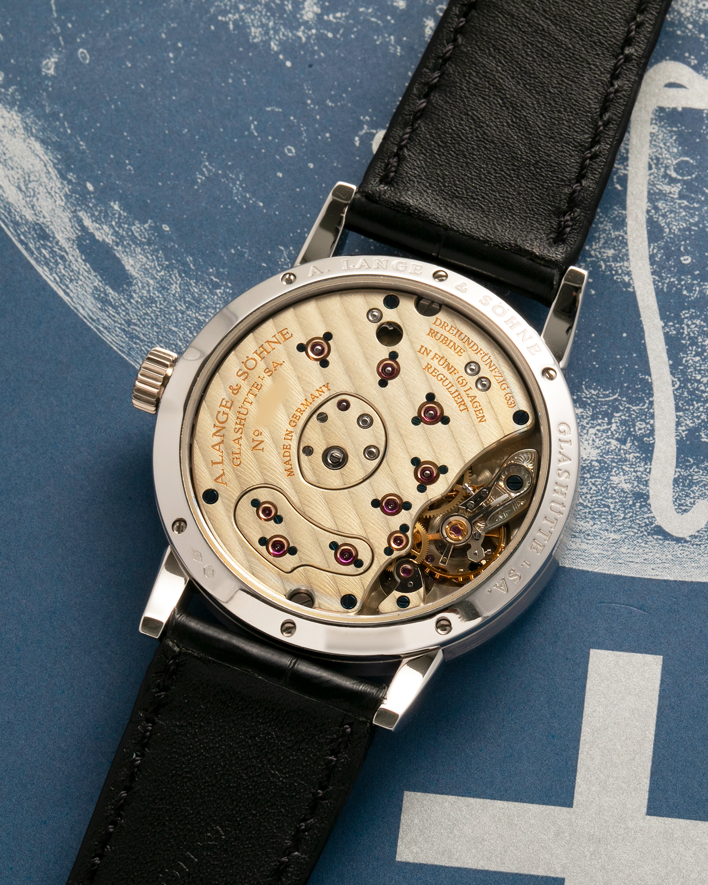 Brand: A. Lange & Söhne
Year: 2005
Model: Little Lange 1 ‘Darth’
Reference: 111.035
Material: Platinum 950
Movement: A. Lange & Söhne Cal. L901.0, Manual Winding
Case Dimensions: 36mm x 10mm (Lug-to-Lug 43mm)
Lug Width: 19mm
Strap: A. Lange & Söhne Black Alligator Leather Strap with Signed Platinum 950 Tang Buckle
