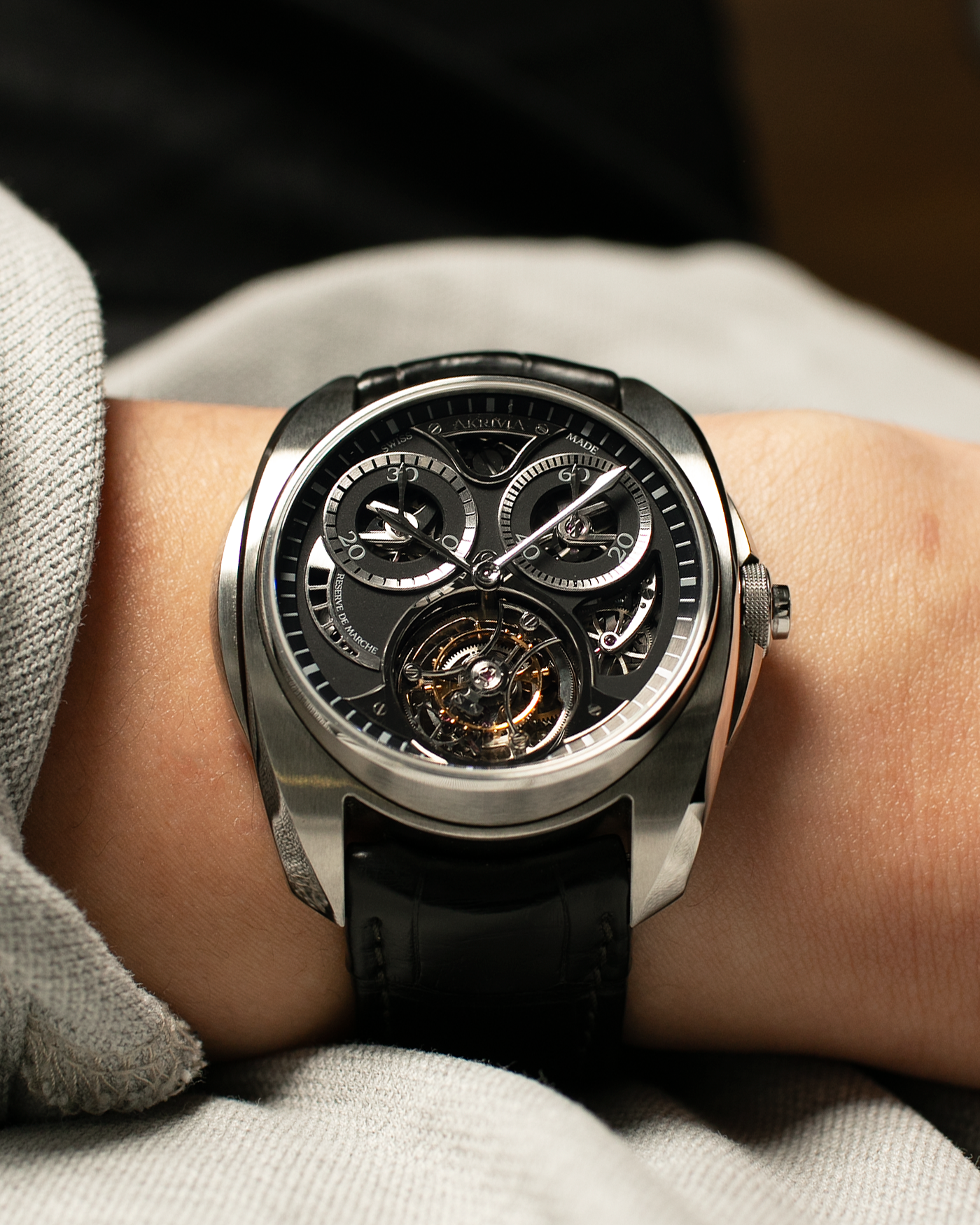 Brand: Akrivia Year: 2016 Model: Tourbillon Chronographe Monopoussoir AK-01 Material: Titanium Movement: Akrivia Cal. AK-01, Manual-Winding Case Dimensions: 42.5mm x 12.9mm (Lug-to-Lug 50mm) Lug Width: 21mm Strap: Akrivia Black Textured Calf Leather Strap with Signed Titanium Tang Buckle