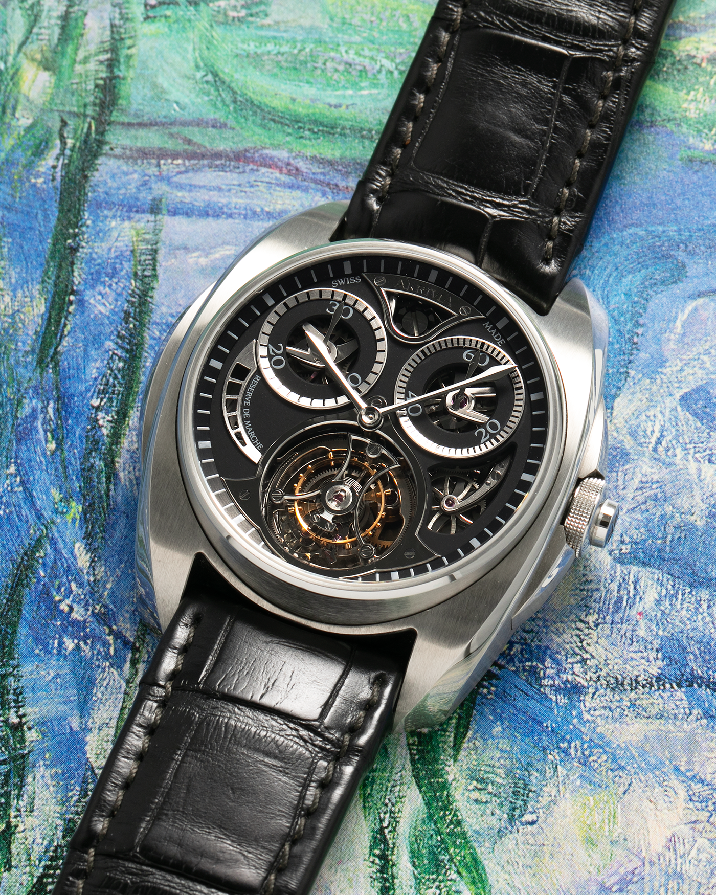 Brand: Akrivia Year: 2016 Model: Tourbillon Chronographe Monopoussoir AK-01 Material: Titanium Movement: Akrivia Cal. AK-01, Manual-Winding Case Dimensions: 42.5mm x 12.9mm (Lug-to-Lug 50mm) Lug Width: 21mm Strap: Akrivia Black Textured Calf Leather Strap with Signed Titanium Tang Buckle