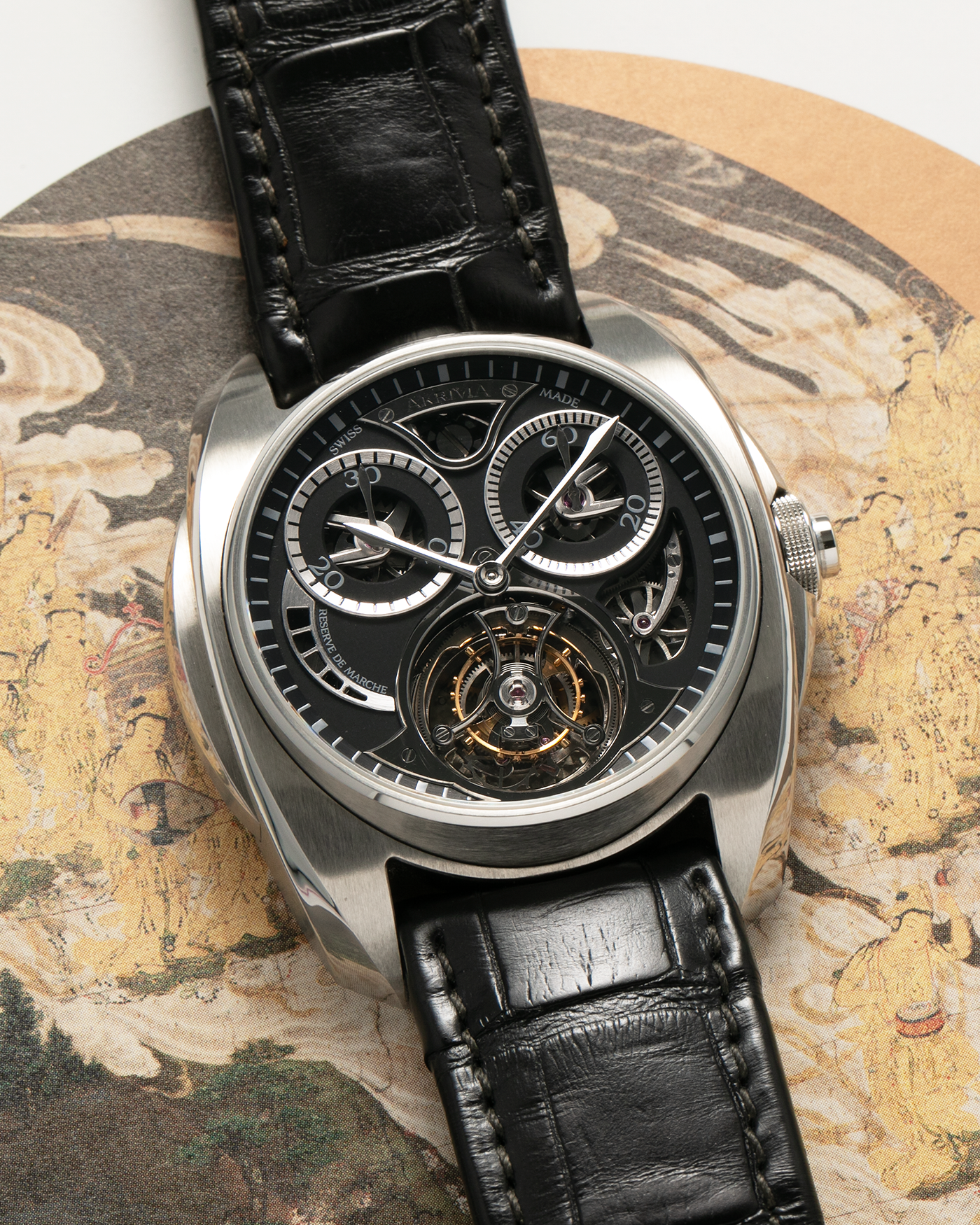 Brand: Akrivia Year: 2016 Model: Tourbillon Chronographe Monopoussoir AK-01 Material: Titanium Movement: Akrivia Cal. AK-01, Manual-Winding Case Dimensions: 42.5mm x 12.9mm (Lug-to-Lug 50mm) Lug Width: 21mm Strap: Akrivia Black Textured Calf Leather Strap with Signed Titanium Tang Buckle