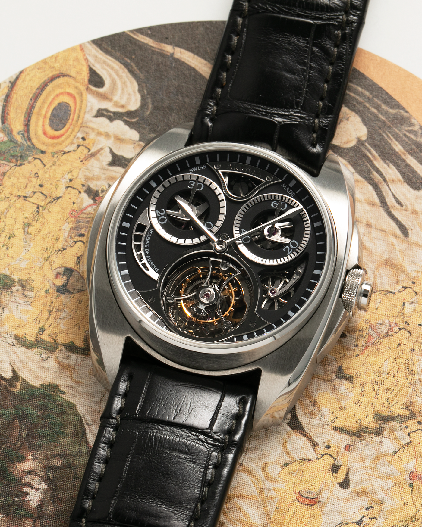 Brand: Akrivia Year: 2016 Model: Tourbillon Chronographe Monopoussoir AK-01 Material: Titanium Movement: Akrivia Cal. AK-01, Manual-Winding Case Dimensions: 42.5mm x 12.9mm (Lug-to-Lug 50mm) Lug Width: 21mm Strap: Akrivia Black Textured Calf Leather Strap with Signed Titanium Tang Buckle