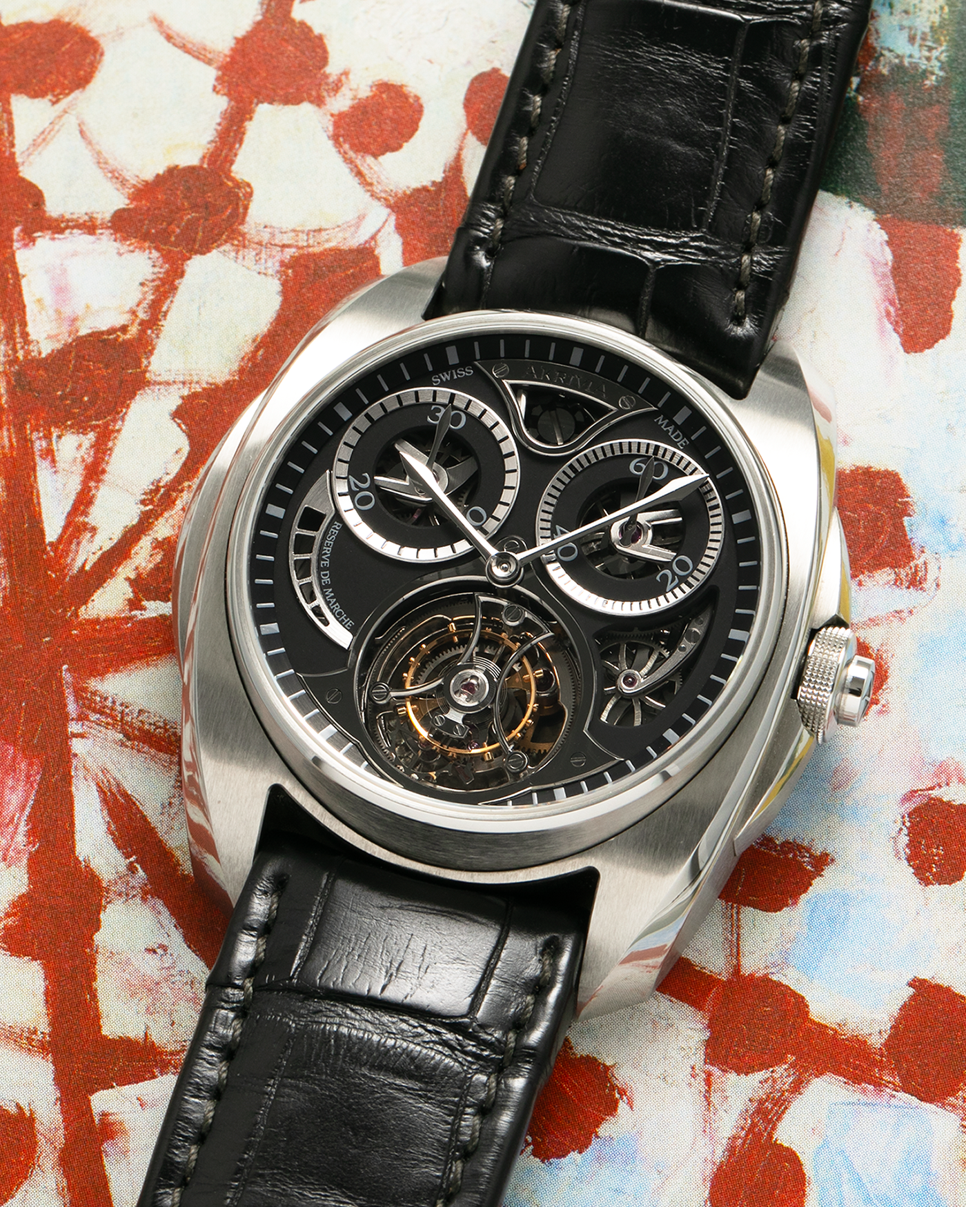 Brand: Akrivia Year: 2016 Model: Tourbillon Chronographe Monopoussoir AK-01 Material: Titanium Movement: Akrivia Cal. AK-01, Manual-Winding Case Dimensions: 42.5mm x 12.9mm (Lug-to-Lug 50mm) Lug Width: 21mm Strap: Akrivia Black Textured Calf Leather Strap with Signed Titanium Tang Buckle