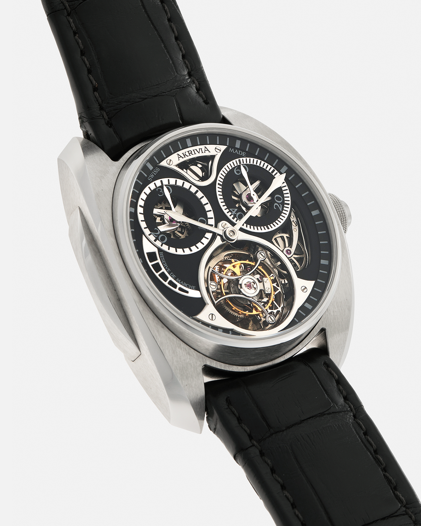 Brand: Akrivia Year: 2016 Model: Tourbillon Chronographe Monopoussoir AK-01 Material: Titanium Movement: Akrivia Cal. AK-01, Manual-Winding Case Dimensions: 42.5mm x 12.9mm (Lug-to-Lug 50mm) Lug Width: 21mm Strap: Akrivia Black Textured Calf Leather Strap with Signed Titanium Tang Buckle