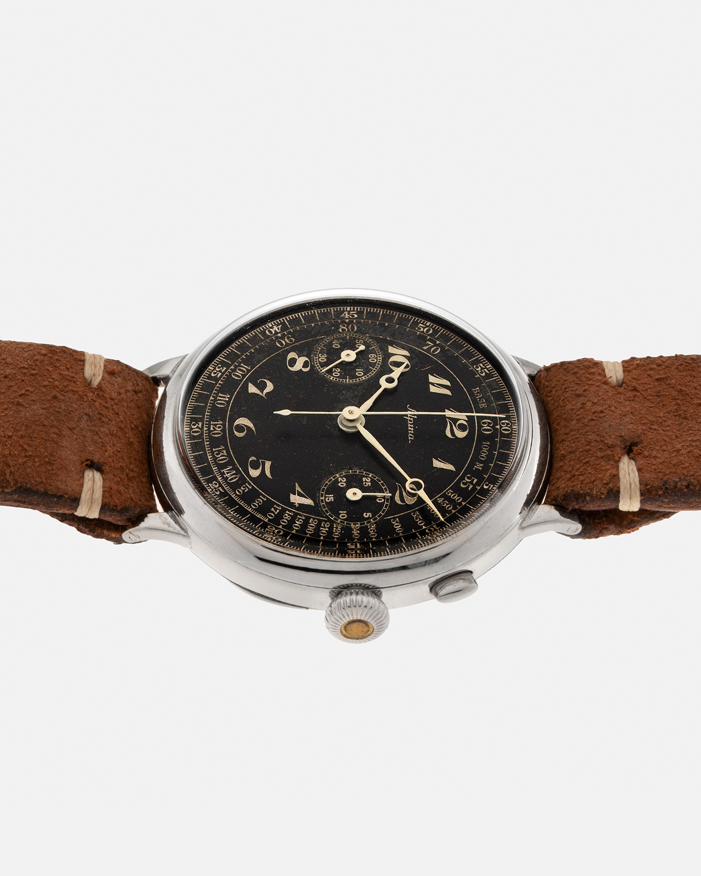 Brand: Alpina Model: Monopusher Chronograph Serial Number: 392919 Year: 1930’s Material: Nickel Chrome Movement: Modified Landeron-Hahn Caliber, Manual-Winding Case Diameter: 41mm Lug Width: 18mm Strap: Unnamed Open End Distressed Brown Leather Strap