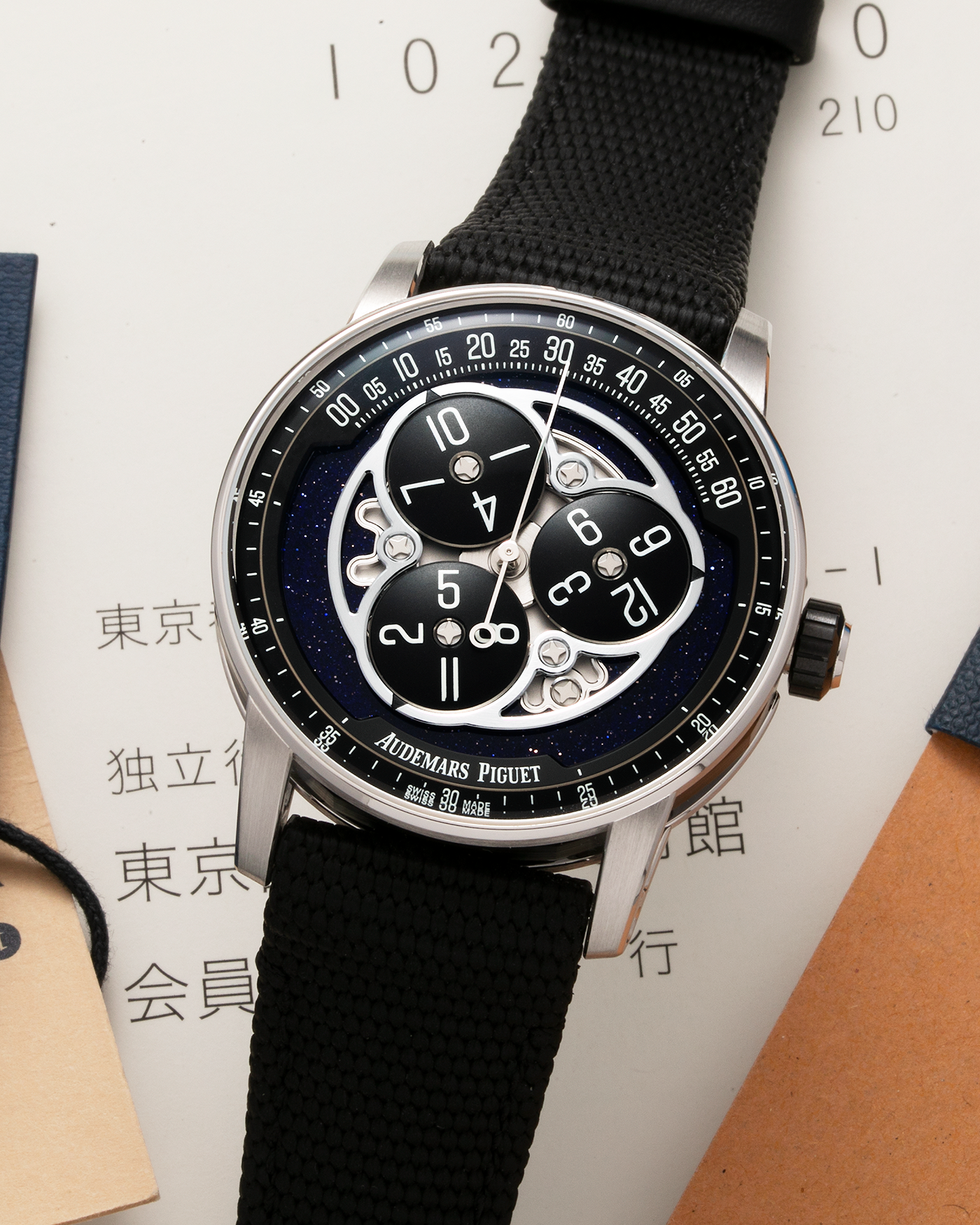 Brand: Audemars Piguet Year: 2023 Model: Code 11.59 ‘Star Wheel’ Reference Number: 15212NB.OO.A002KB.01 Material: Black Ceramic Case, 18-carat White Gold Bezel, Second-Hand, Lugs and Caseback, Blue Aventurine Dial, Black Opaline Aluminium Discs   Movement: Audemars Piguet Cal. 4310, Self-Winding Case Dimensions: 41mm x 10.7mm Strap: Audemars Piguet Textured Black Rubber-Coated Strap with Signed 18-carat White Gold Tang Buckle
