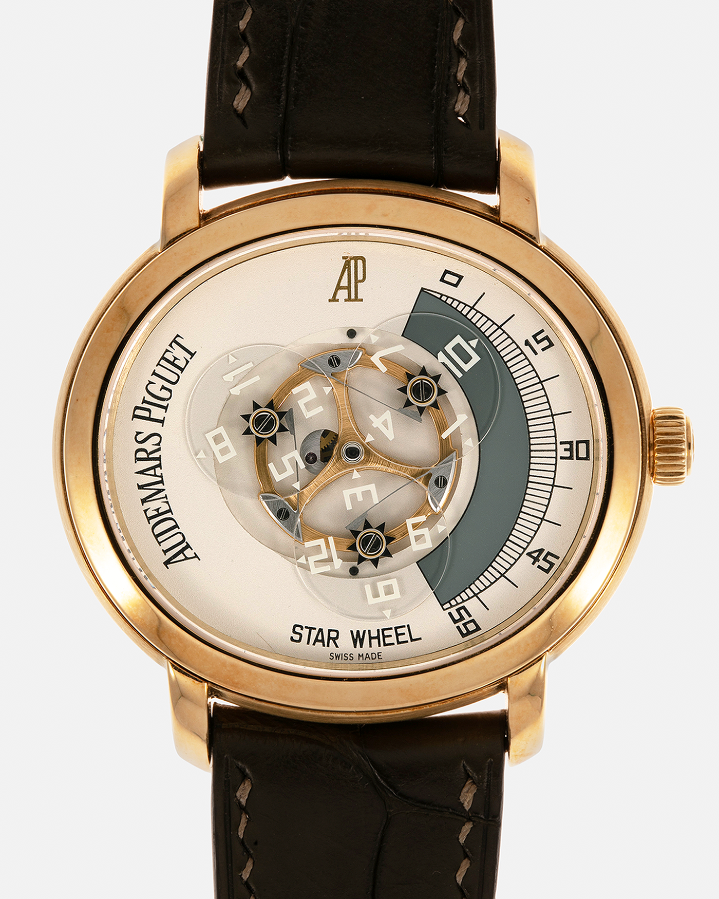 Brand: Audemars Piguet Year: 2000 Model: Millenary ‘Star Wheel’, Limited to 50 Pieces in 18-carat Yellow Gold  Reference Number: 25898BA Material: 18-carat Yellow Gold  Movement: Audemars Piguet Cal. 2224, Self-Winding Case Diameter: 41mm Lug Width: 20mm Bracelet: Olive Green Alligator Leather Strap with Signed 18-carat Yellow Gold Tang Buckle