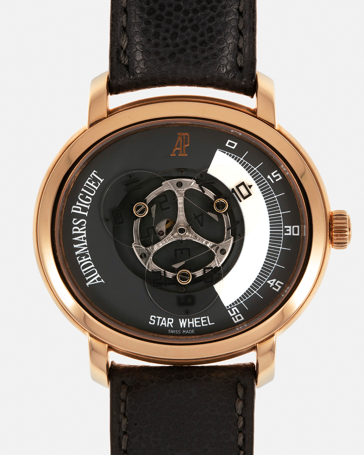 Brand: Audemars Piguet Year: 2000 Model: Millenary ‘Star Wheel’, Limited to 75 Pieces in 18-carat Rose Gold  Reference Number: 25898OR Material: 18-carat Rose Gold  Movement: Audemars Piguet Cal. 2224, Self-Winding Case Diameter: 41mm Lug Width: 20mm Bracelet: Audemars Piguet Dark Grey Grained Calf Leather Strap with Signed 18-carat Rose Gold ‘AP’ Deployant Buckle
