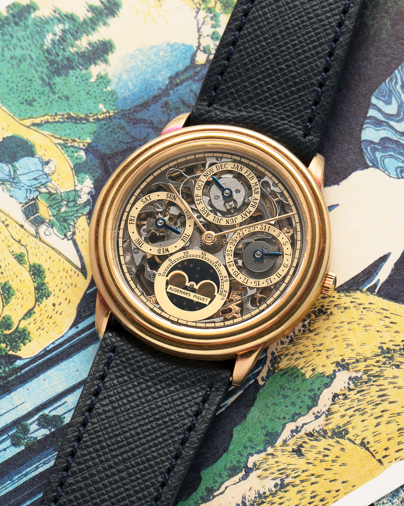 Brand: Audemars Piguet Year: 1980’s Model: Quantieme Perpetual Calendar Openworked Reference Number: 25668BA Material: 18-carat Yellow Gold Movement: Audemars Piguet Cal. 2120/2800, Self-Winding Case Dimensions: 36mm x 8mm (Lug-to-Lug 37mm) Lug Width: 20mm Strap: Molequin Dark Navy Textured Calf Leather Strap with Signed 18-carat Yellow Gold Tang Buckle
