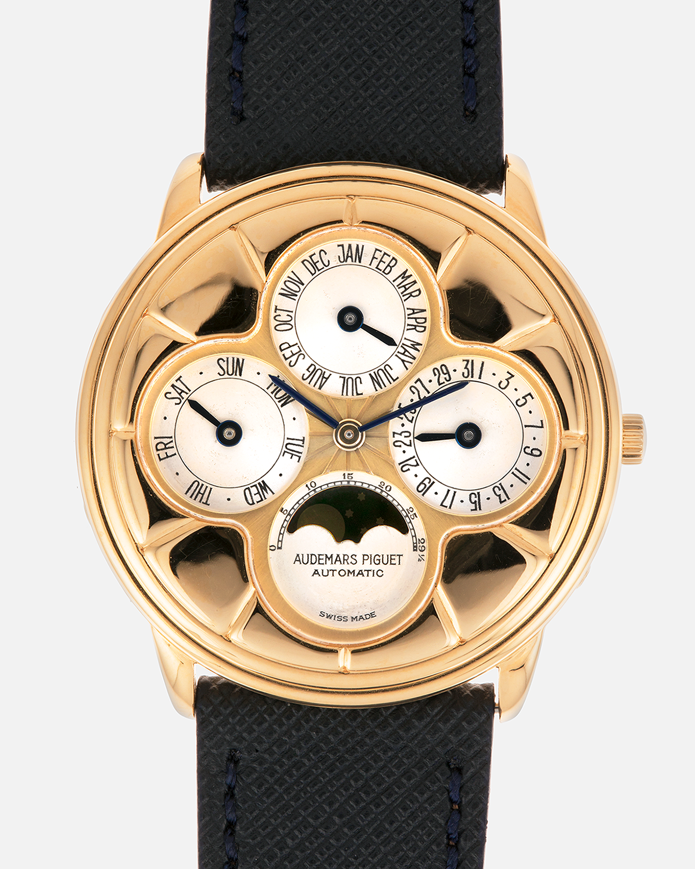 Brand: Audemars Piguet
Year: 1990s
Model: Quantième Perpetual Calendar ‘Clover’
Reference: 25681BA
Material: 18-carat Yellow Gold
Movement: Audemars Piguet Cal. 2120/2, Self-Winding
Case Dimensions: 36mm x 8mm (Lug-to-Lug 38.5mm)
Lug Width: 20mm
Straps: Molequin Dark Navy Textured Calf Leather Strap with 18k Yellow Gold Audemars Piguet Deployant Clasp