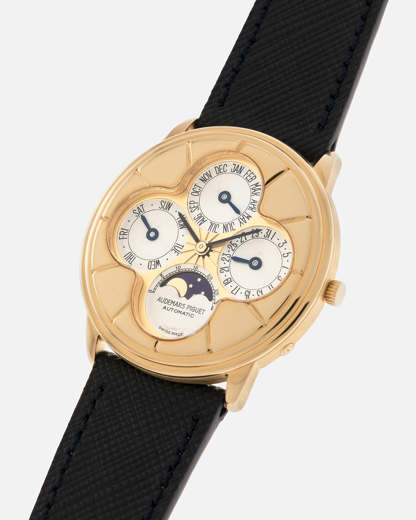 Brand: Audemars Piguet
Year: 1990s
Model: Quantième Perpetual Calendar ‘Clover’
Reference: 25681BA
Material: 18-carat Yellow Gold
Movement: Audemars Piguet Cal. 2120/2, Self-Winding
Case Dimensions: 36mm x 8mm (Lug-to-Lug 38.5mm)
Lug Width: 20mm
Straps: Molequin Dark Navy Textured Calf Leather Strap with 18k Yellow Gold Audemars Piguet Deployant Clasp