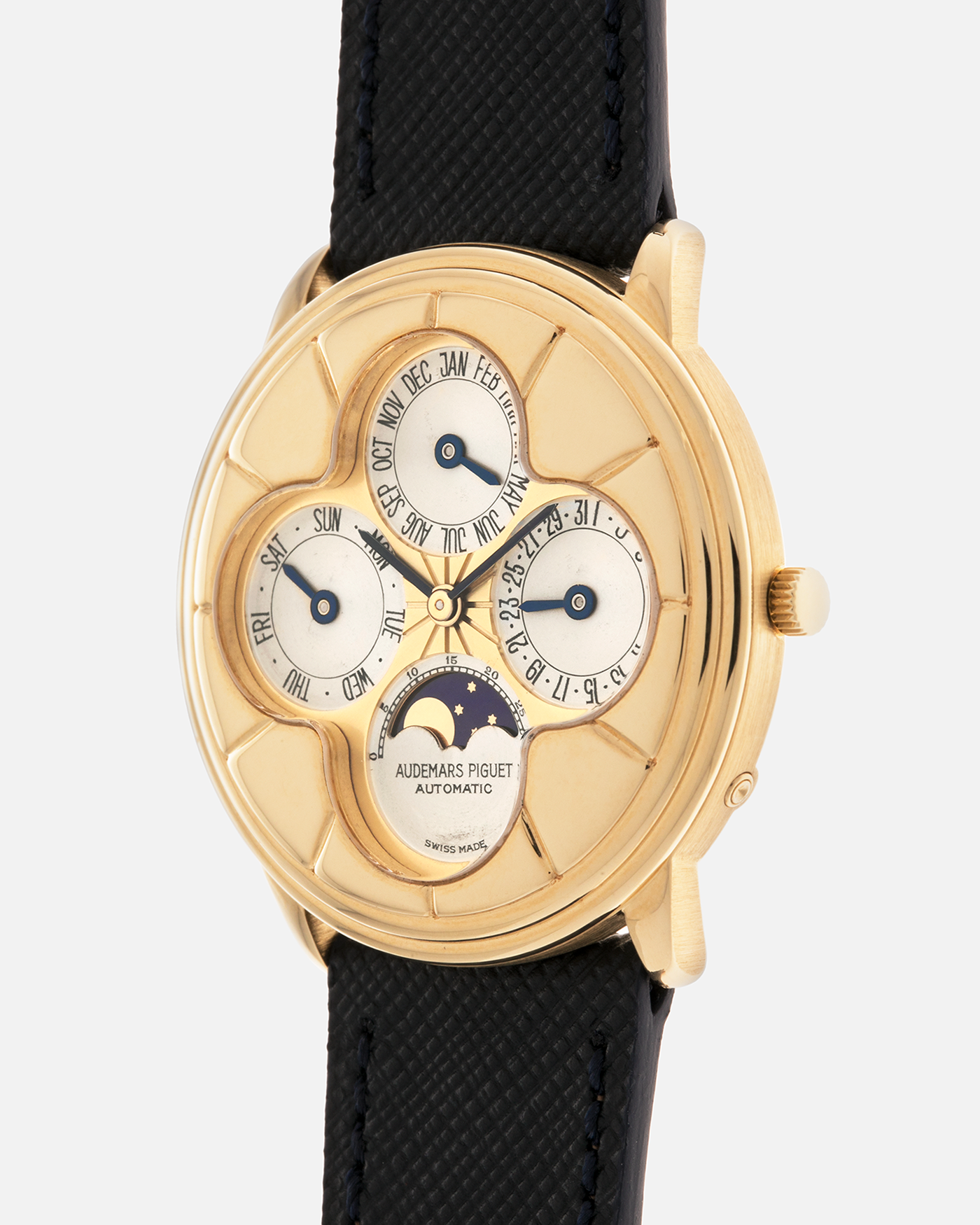 Brand: Audemars Piguet
Year: 1990s
Model: Quantième Perpetual Calendar ‘Clover’
Reference: 25681BA
Material: 18-carat Yellow Gold
Movement: Audemars Piguet Cal. 2120/2, Self-Winding
Case Dimensions: 36mm x 8mm (Lug-to-Lug 38.5mm)
Lug Width: 20mm
Straps: Molequin Dark Navy Textured Calf Leather Strap with 18k Yellow Gold Audemars Piguet Deployant Clasp