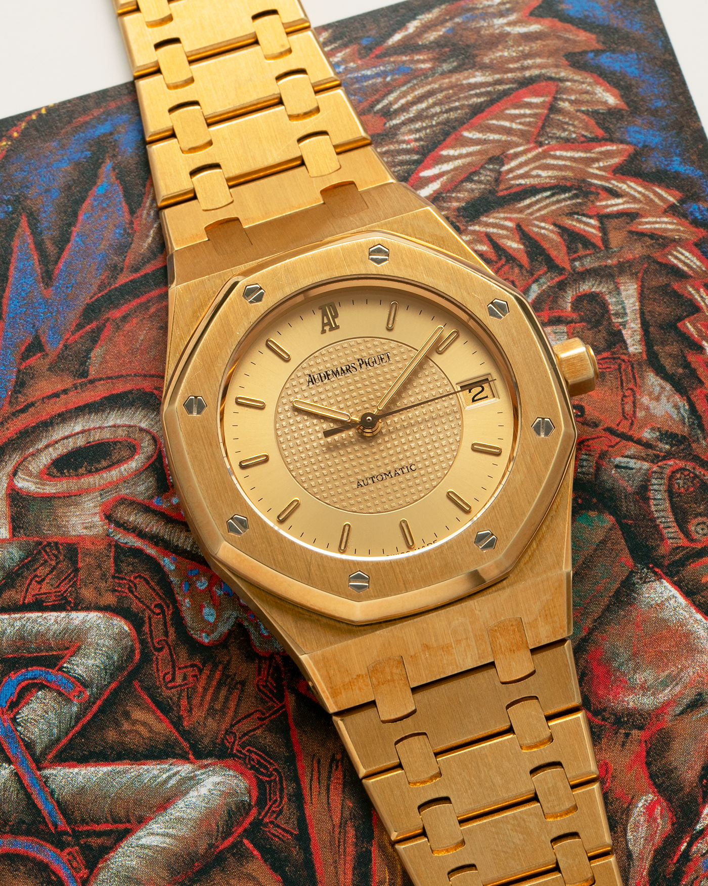 Brand: Audemars Piguet
Year: 1992
Model: Royal Oak ‘Nick Faldo’
Reference: 15090BA
Material: 18-carat Yellow Gold
Movement: Audemars Piguet Cal. 2225 (Derived from JLC Cal. 889), Self-Winding
Case Dimensions: 36mm x 8mm (Lug-to-Lug 46mm)
Bracelet: Audemars Piguet Integrated Bracelet in 18-carat Yellow Gold with Signed Folding Clasp