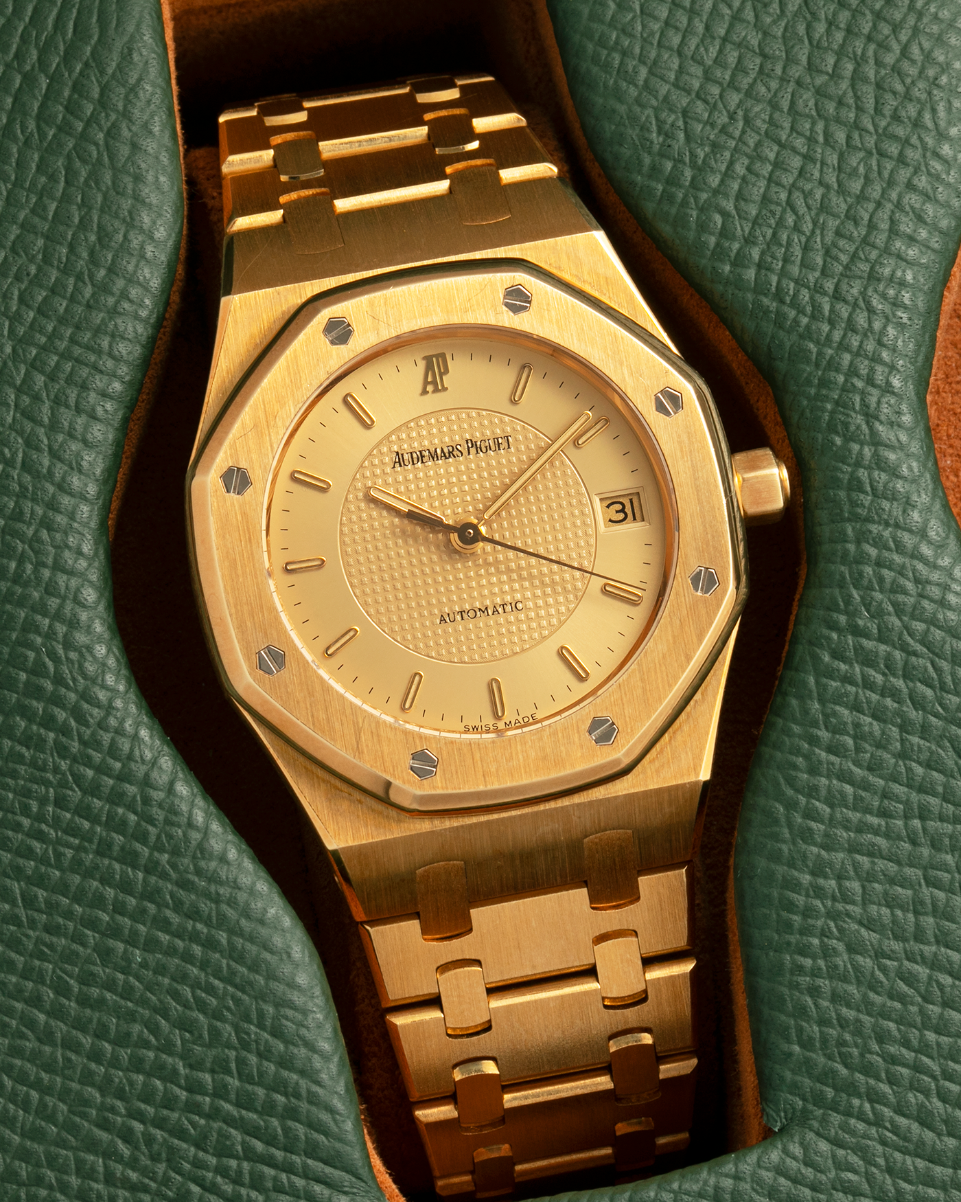 Brand: Audemars Piguet
Year: 1992
Model: Royal Oak ‘Nick Faldo’
Reference: 15090BA
Material: 18-carat Yellow Gold
Movement: Audemars Piguet Cal. 2225 (Derived from JLC Cal. 889), Self-Winding
Case Dimensions: 36mm x 8mm (Lug-to-Lug 46mm)
Bracelet: Audemars Piguet Integrated Bracelet in 18-carat Yellow Gold with Signed Folding Clasp
