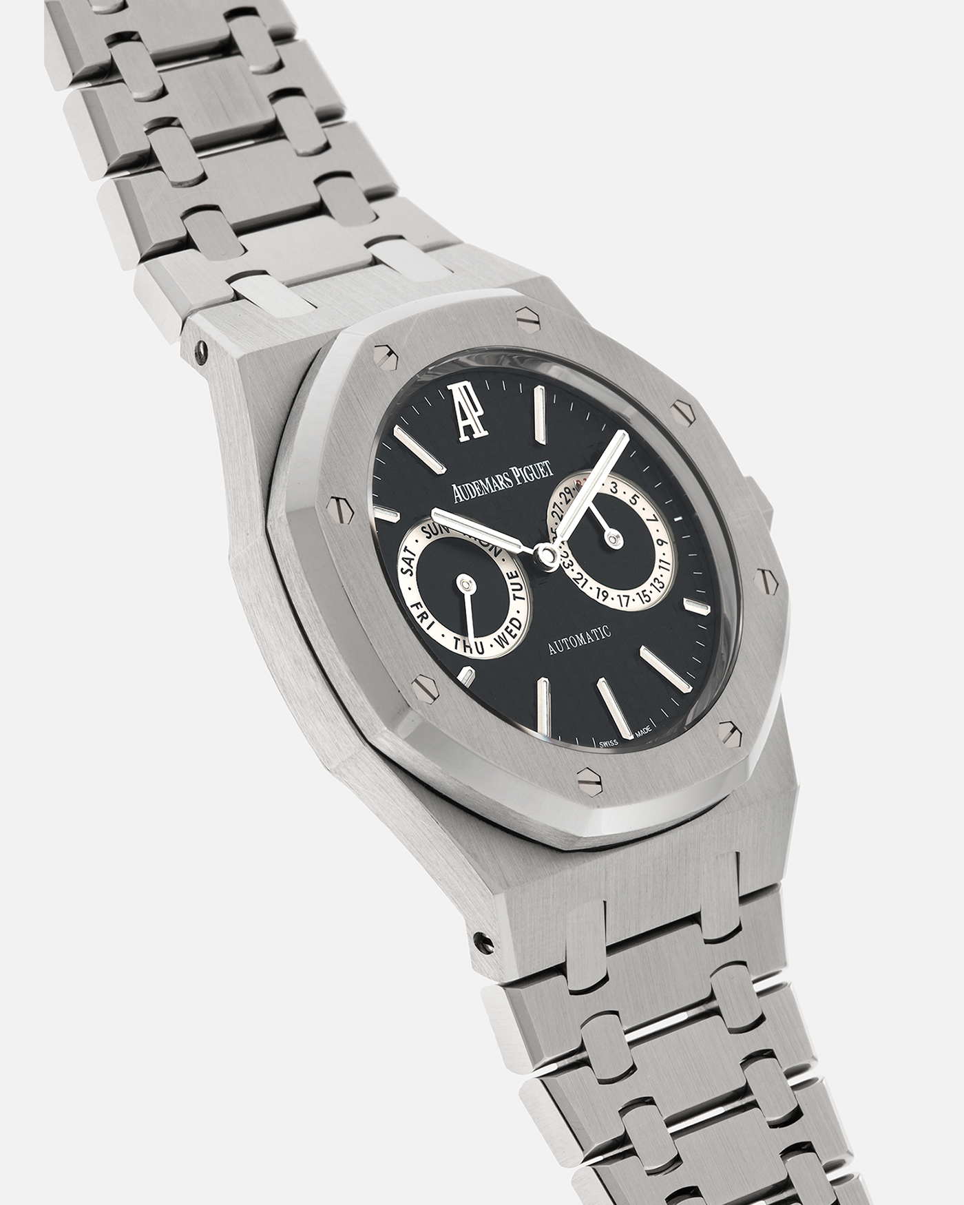 Brand: Audemars Piguet
Year: 2012
Model: Royal Oak Day Date
Reference: 26330ST.OO.1220ST.01.A
Material: Stainless Steel
Movement: Audemars Piguet Cal 2324/2810 (Derived from JLC Cal. 889), Self-Winding
Case Dimensions: 39mm x 10.5 (Lug-to-Lug 49mm)
Bracelet: Audemars Piguet Stainless Steel Integrated Bracelet