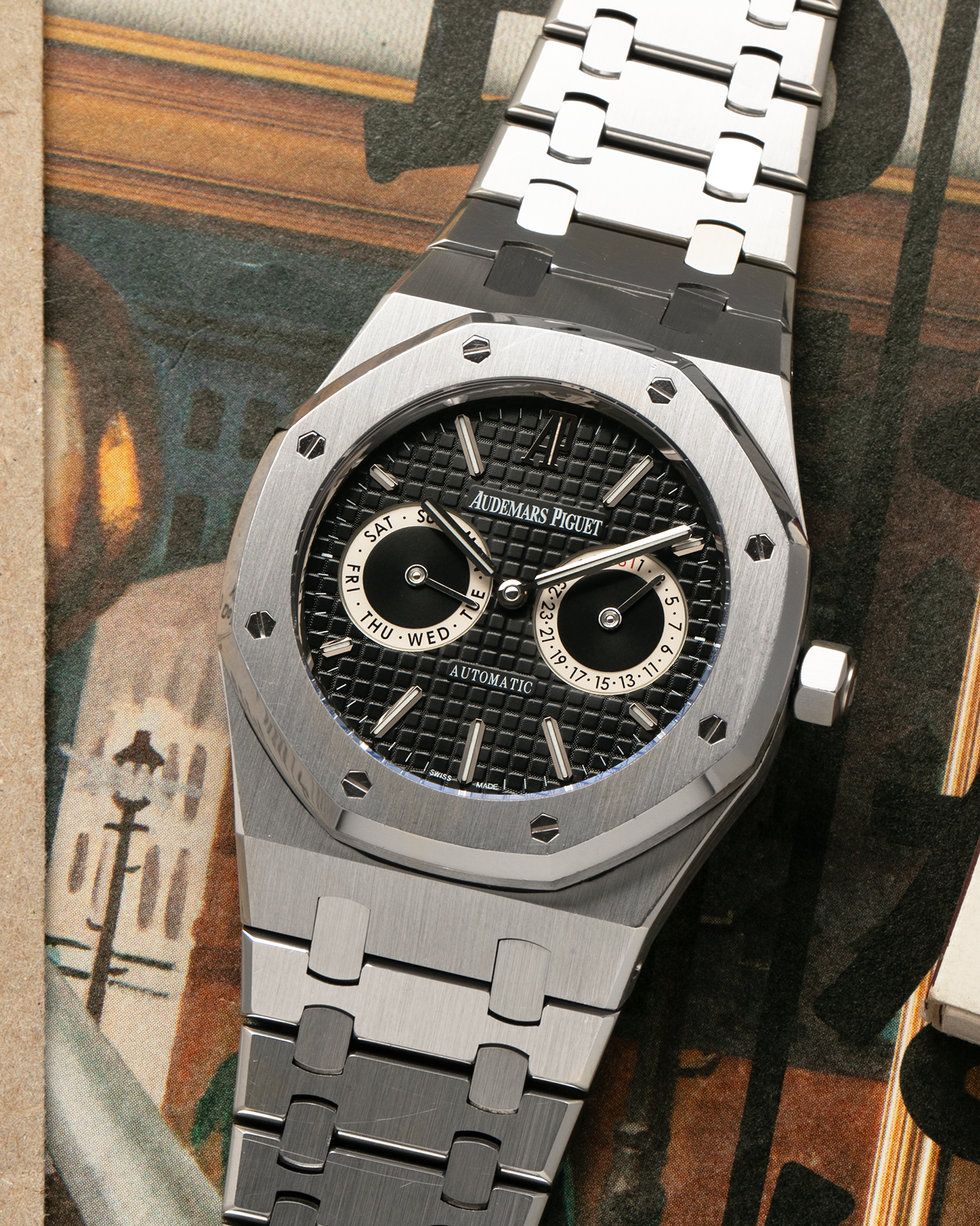 Brand: Audemars Piguet
Year: 2012
Model: Royal Oak Day Date
Reference: 26330ST.OO.1220ST.01.A
Material: Stainless Steel
Movement: Audemars Piguet Cal 2324/2810 (Derived from JLC Cal. 889), Self-Winding
Case Dimensions: 39mm x 10.5 (Lug-to-Lug 49mm)
Bracelet: Audemars Piguet Stainless Steel Integrated Bracelet