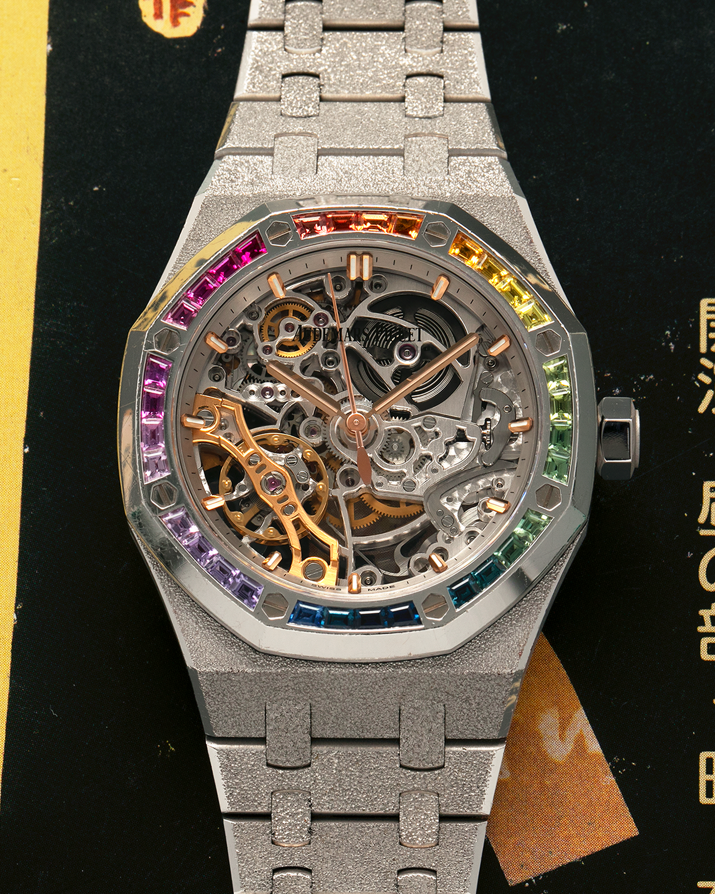 Brand: Audemars Piguet
Year: 2019
Model: Royal Oak
Reference Number: 15468BC
Material: 18-carat White Gold, Multi-Colored Baguette-Cut Sapphires
Movement: Audemars Piguet Cal. 3132, Self-Winding
Case Dimensions: 37mm x 10mm (46.2mm Lug-to-Lug)
Bracelet: Audemars Piguet Integrated 18-carat White Gold Bracelet with Frosted Finish and signed ‘AP’ Folding Clasp
