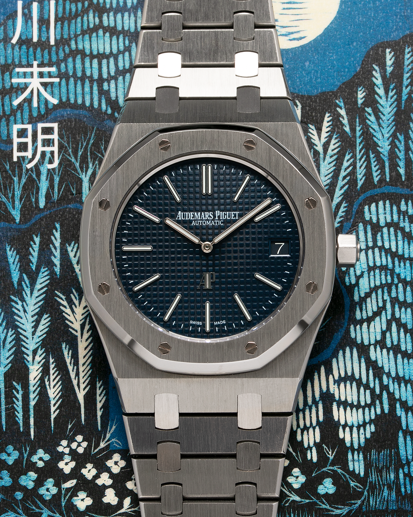 Brand: Audemars Piguet Year: 2014 Model: Royal Oak Reference Number: 15202ST.OO.1240ST.01 Material: Stainless Steel Movement: Audemars Piguet Cal. 2121 (Derived from JLC Cal. 920), Self-Winding Case Dimensions: 39mm x 8.1mm Bracelet: Audemars Piguet Stainless Steel Integrated Bracelet