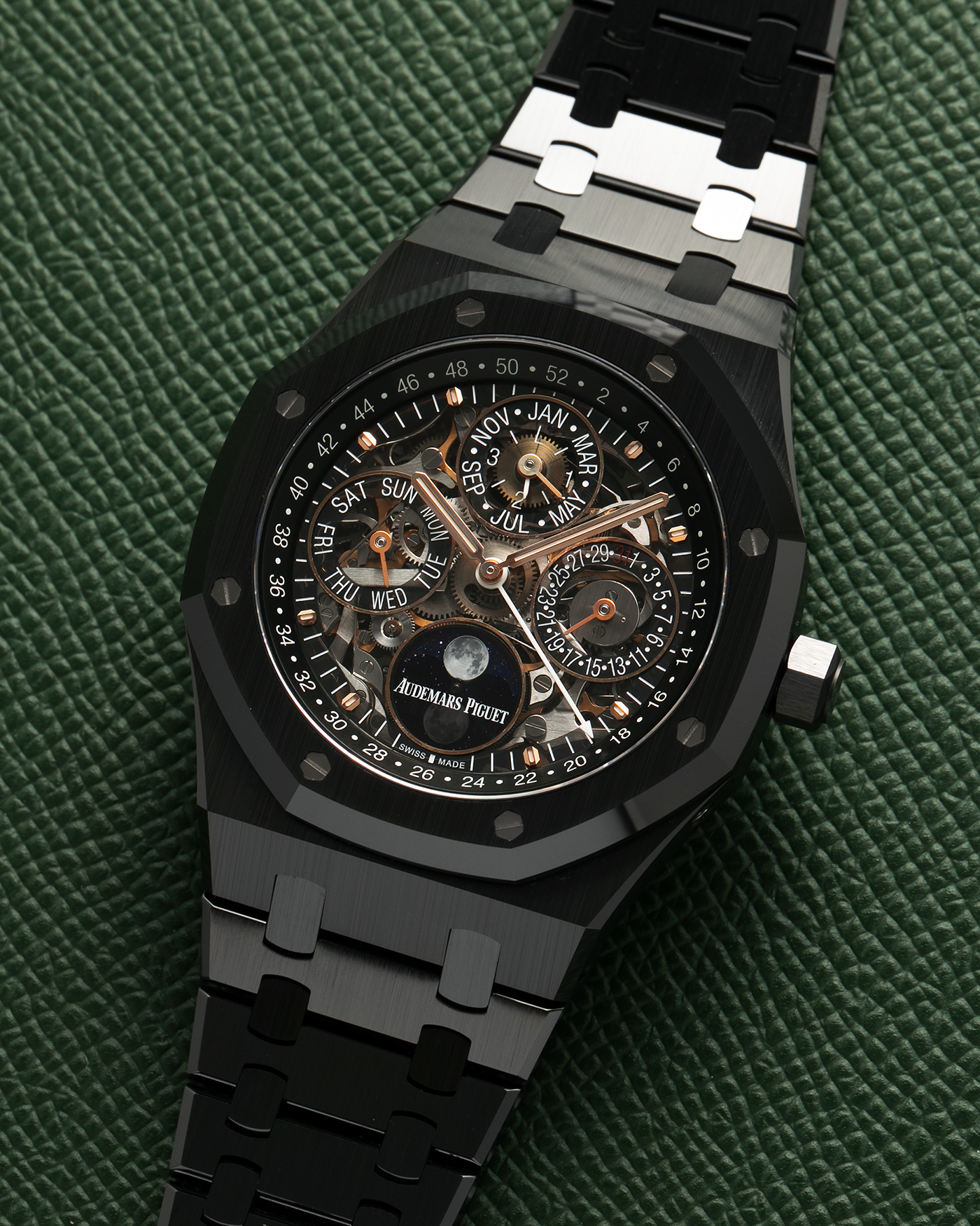 Brand: Audemars Piguet Year: 2021 Model: Royal Oak Perpetual Calendar Openworked, Boutique-only Edition Reference Number: 26585CE Material: Ceramic Movement: Audemars Piguet Cal. 5135, Self-Winding Case Dimensions: 41mm x 9.9mm Bracelet: Audemars Piguet Integrated Black Ceramic Bracelet with Signed Titanium Clasp