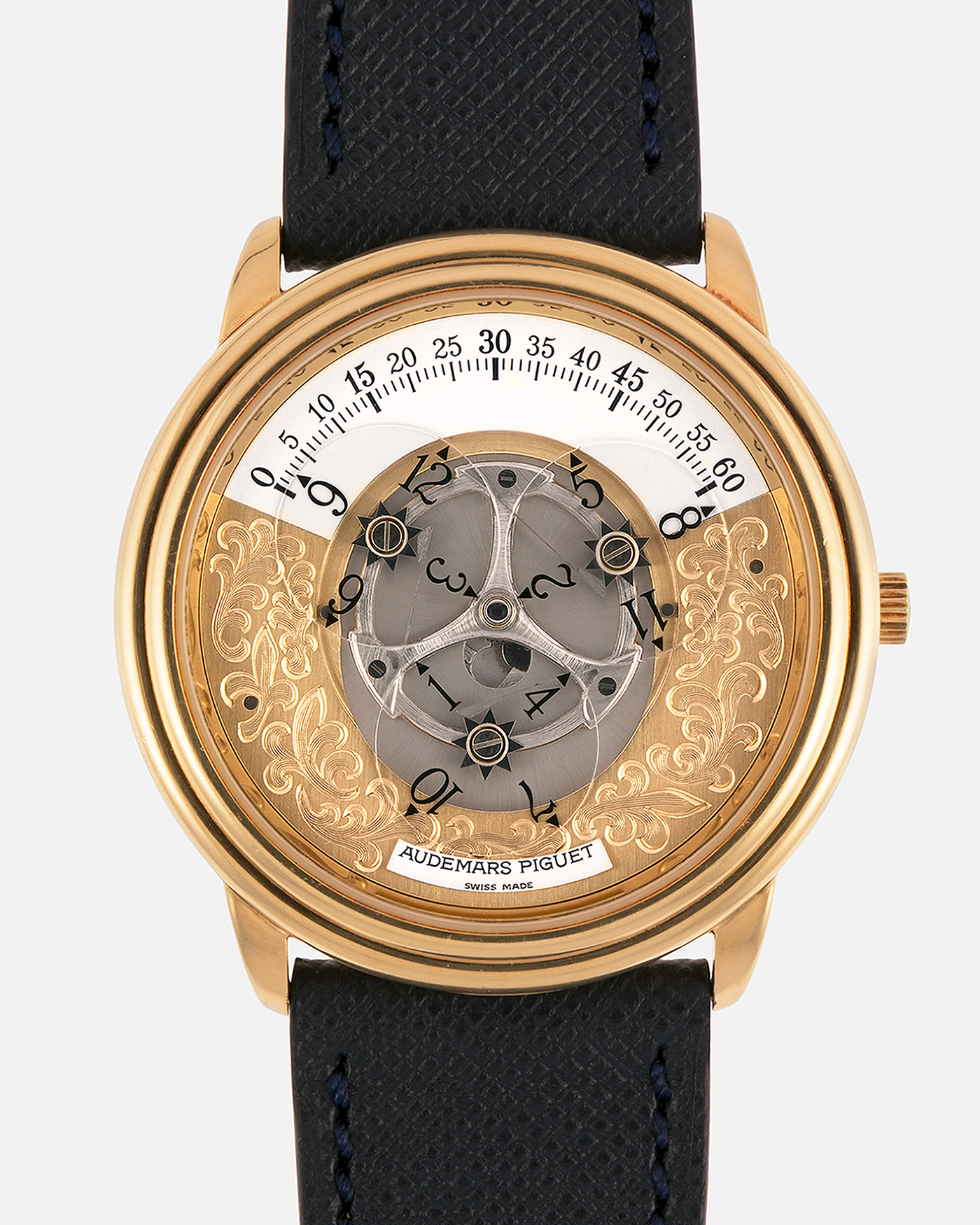 Brand: Audemars Piguet
Year: 1990’s
Model: Star Wheel
Reference Number: 25720BA
Material: 18-carat Yellow Gold 
Movement: AP Cal. 2224, Self-Winding
Case Diameter: 36mm
Strap: Molequin Navy Blue Textured Calf Leather Strap with 18-carat Yellow Gold Audemars Piguet Tang Buckle