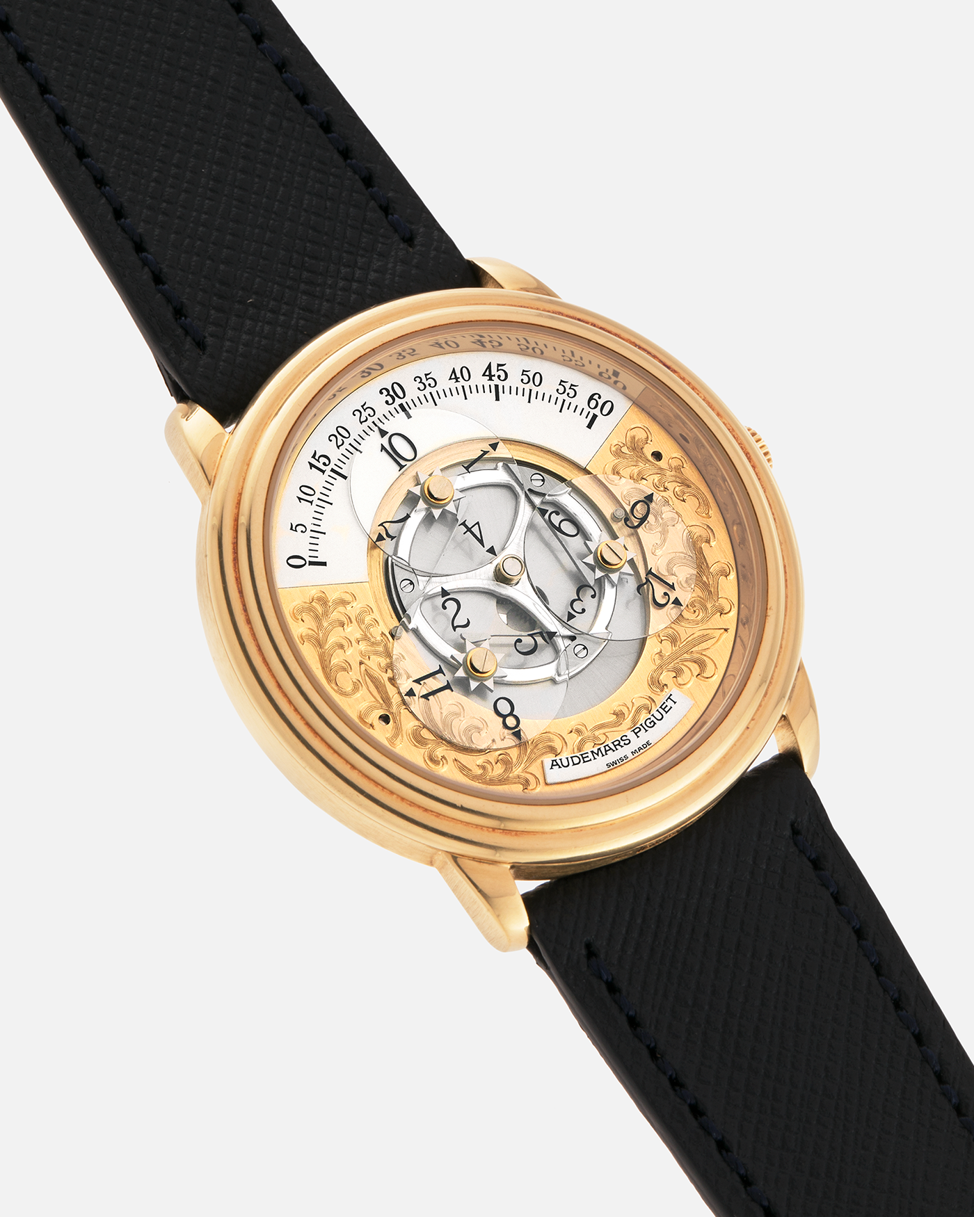 Brand: Audemars Piguet
Year: 1990’s
Model: Star Wheel
Reference Number: 25720BA
Material: 18-carat Yellow Gold 
Movement: AP Cal. 2224, Self-Winding
Case Diameter: 36mm
Strap: Molequin Navy Blue Textured Calf Leather Strap with 18-carat Yellow Gold Audemars Piguet Tang Buckle