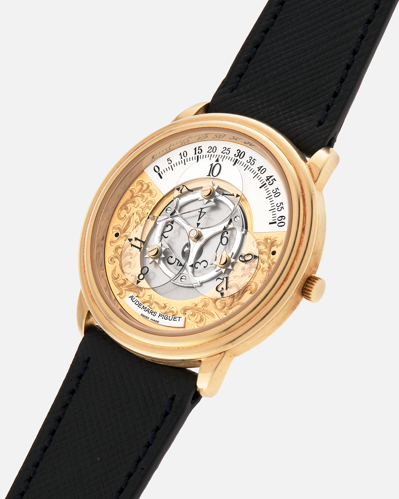Brand: Audemars Piguet
Year: 1990’s
Model: Star Wheel
Reference Number: 25720BA
Material: 18-carat Yellow Gold 
Movement: AP Cal. 2224, Self-Winding
Case Diameter: 36mm
Strap: Molequin Navy Blue Textured Calf Leather Strap with 18-carat Yellow Gold Audemars Piguet Tang Buckle