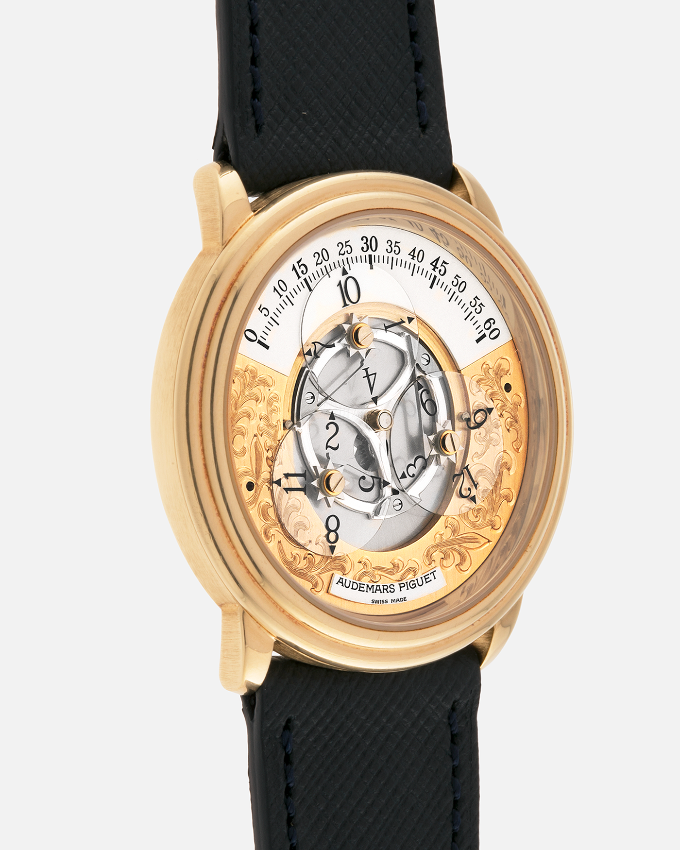 Brand: Audemars Piguet
Year: 1990’s
Model: Star Wheel
Reference Number: 25720BA
Material: 18-carat Yellow Gold 
Movement: AP Cal. 2224, Self-Winding
Case Diameter: 36mm
Strap: Molequin Navy Blue Textured Calf Leather Strap with 18-carat Yellow Gold Audemars Piguet Tang Buckle