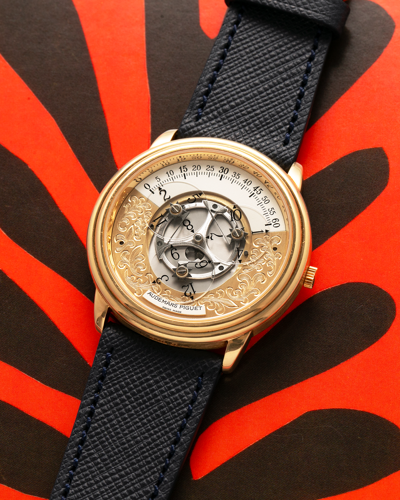 Brand: Audemars Piguet
Year: 1990’s
Model: Star Wheel
Reference Number: 25720BA
Material: 18-carat Yellow Gold 
Movement: AP Cal. 2224, Self-Winding
Case Diameter: 36mm
Strap: Molequin Navy Blue Textured Calf Leather Strap with 18-carat Yellow Gold Audemars Piguet Tang Buckle