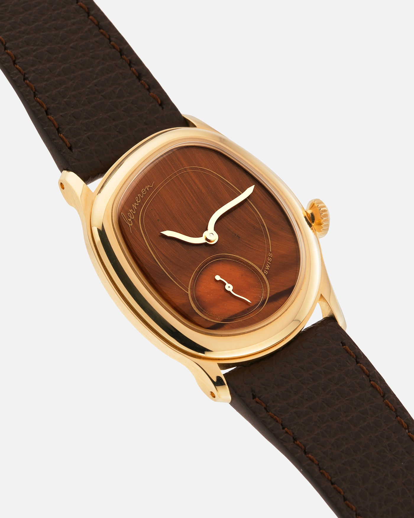 Brand: Berneron
Year: 2025
Model: Mirage 34 Tiger Eye
Reference Number: 3034MS.G23
Material: 18k Yellow Gold
Movement: In-House, Manually-Wound Cal. 215
Case Dimensions: 34mm X 30mm (7mm Thickness)
Strap: Berneron Red Brown Barenia Leather Strap and Berneron 18k Yellow Gold Tang Buckle