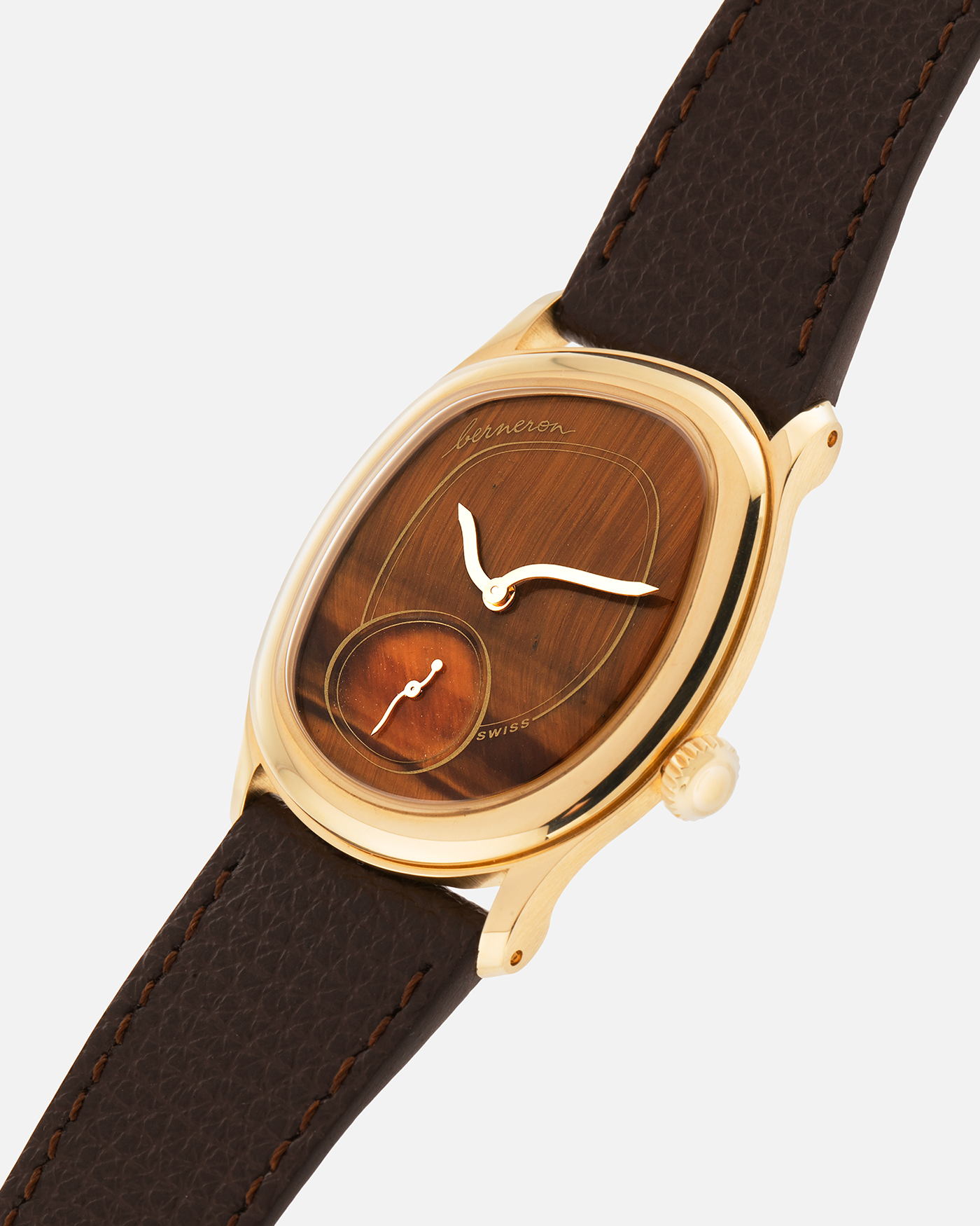 Brand: Berneron
Year: 2025
Model: Mirage 34 Tiger Eye
Reference Number: 3034MS.G23
Material: 18k Yellow Gold
Movement: In-House, Manually-Wound Cal. 215
Case Dimensions: 34mm X 30mm (7mm Thickness)
Strap: Berneron Red Brown Barenia Leather Strap and Berneron 18k Yellow Gold Tang Buckle