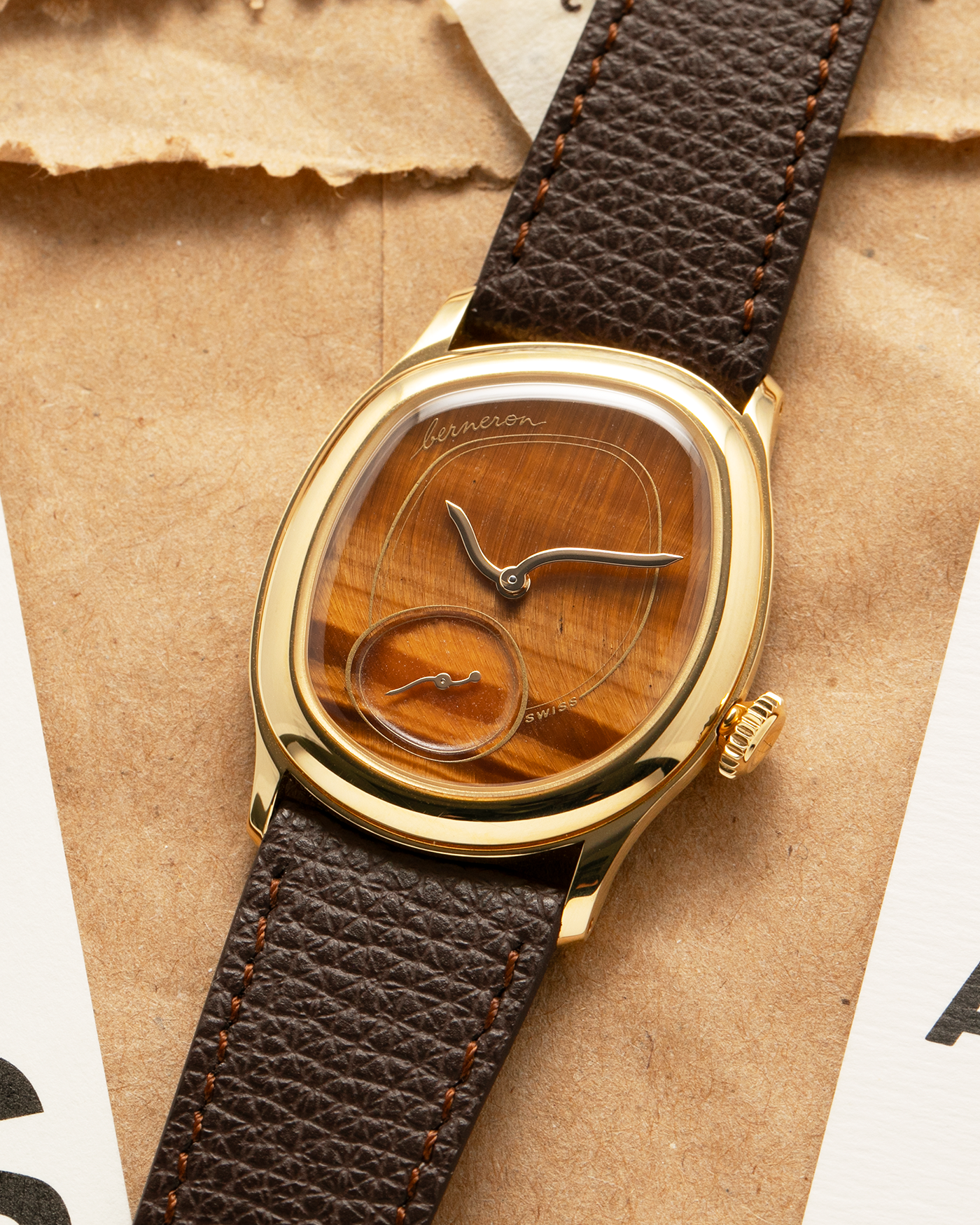 Brand: Berneron
Year: 2025
Model: Mirage 34 Tiger Eye
Reference Number: 3034MS.G23
Material: 18k Yellow Gold
Movement: In-House, Manually-Wound Cal. 215
Case Dimensions: 34mm X 30mm (7mm Thickness)
Strap: Berneron Red Brown Barenia Leather Strap and Berneron 18k Yellow Gold Tang Buckle