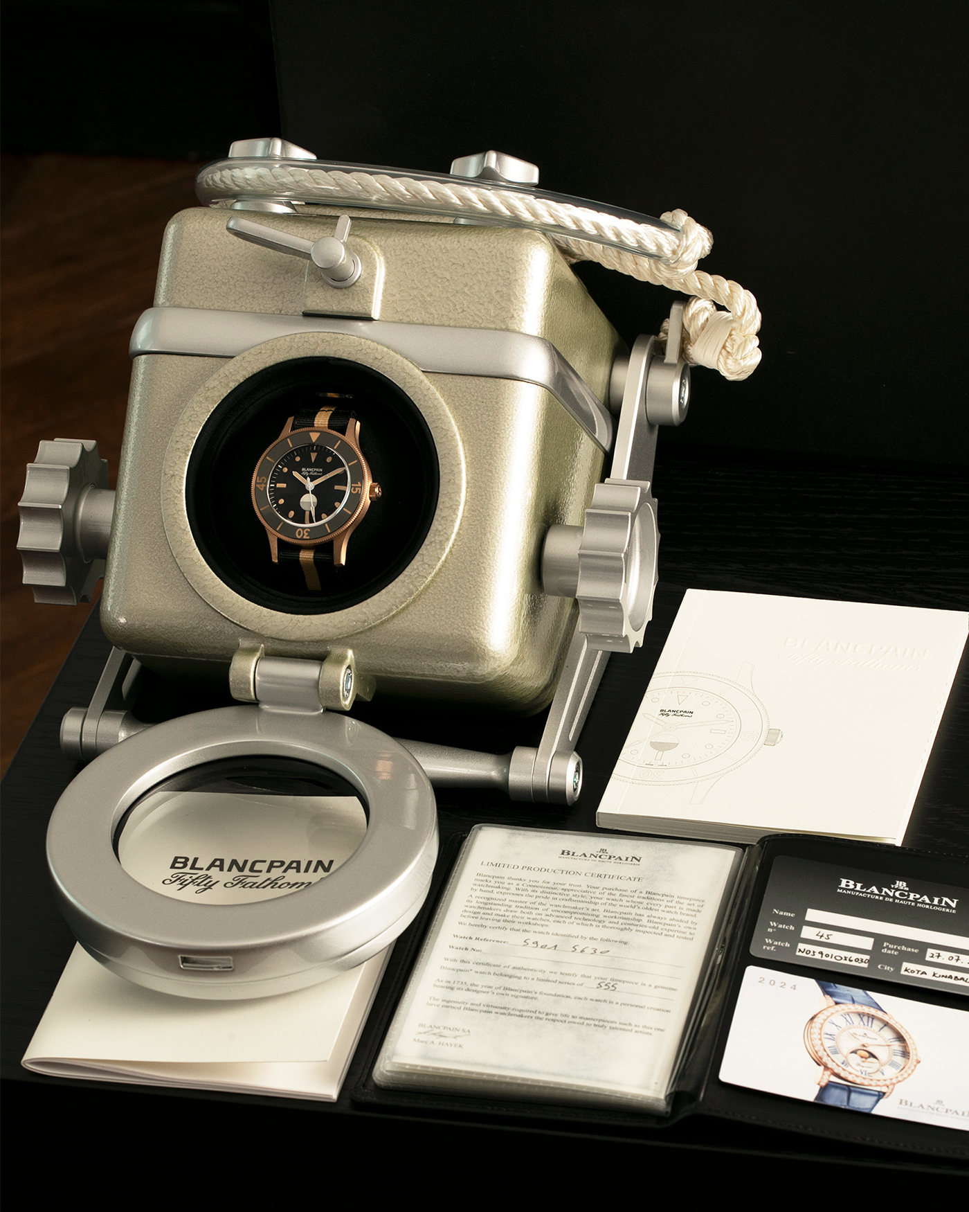 Brand: Blancpain
Year: 2024
Model: Fifty Fathoms 70th Anniversary Act 3, Limited Edition of 555 Pieces
Reference Number: 5901-5630 NANA
Material: 9-carat Bronze Gold, Black Ceramic Bezel Insert
Movement: Blancpain Cal. 1154.P2 (Derived from Blancpain Cal. 1150), Self-Winding
Case Dimensions: 41.3mm x 13.3mm (Lug-to-Lug 41.3mm)
Lug Width: 20mm
Strap: Blancpain Two-Tone NATO Strap with Signed 9-carat Bronze Gold Tang Buckle