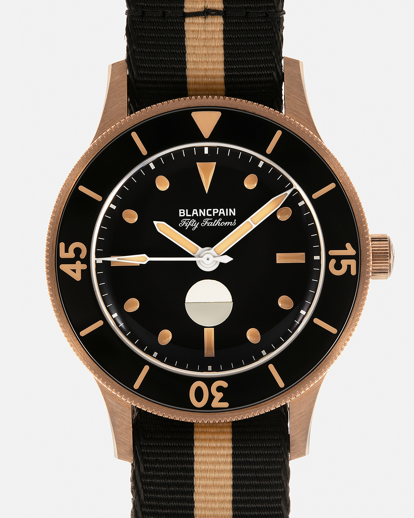 Brand: Blancpain
Year: 2024
Model: Fifty Fathoms 70th Anniversary Act 3, Limited Edition of 555 Pieces
Reference Number: 5901-5630 NANA
Material: 9-carat Bronze Gold, Black Ceramic Bezel Insert
Movement: Blancpain Cal. 1154.P2 (Derived from Blancpain Cal. 1150), Self-Winding
Case Dimensions: 41.3mm x 13.3mm (Lug-to-Lug 41.3mm)
Lug Width: 20mm
Strap: Blancpain Two-Tone NATO Strap with Signed 9-carat Bronze Gold Tang Buckle