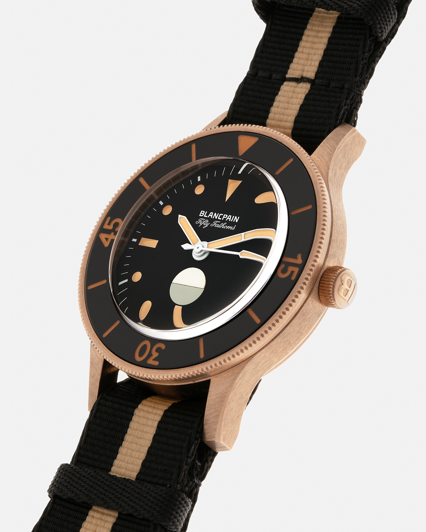 Brand: Blancpain
Year: 2024
Model: Fifty Fathoms 70th Anniversary Act 3, Limited Edition of 555 Pieces
Reference Number: 5901-5630 NANA
Material: 9-carat Bronze Gold, Black Ceramic Bezel Insert
Movement: Blancpain Cal. 1154.P2 (Derived from Blancpain Cal. 1150), Self-Winding
Case Dimensions: 41.3mm x 13.3mm (Lug-to-Lug 41.3mm)
Lug Width: 20mm
Strap: Blancpain Two-Tone NATO Strap with Signed 9-carat Bronze Gold Tang Buckle