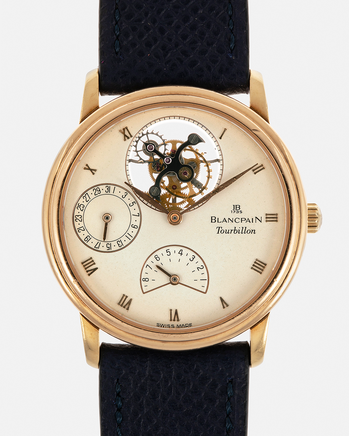 Brand: Blancpain
Year: 1996
Model: Villeret Flying Tourbillon 8 Days, Limited to 99 Pieces Across all Metals
Reference: 0023-1418-55
Material: 18-carat Yellow Gold
Movement: Blancpain Cal. 23, Manual-Winding Flying Tourbillon
Case Dimensions: 34mm x 7.4mm (Lug-to-Lug 40mm)
Lug Width: 19mm
Strap: Nostime Dark Navy Textured Calf Leather Strap with Signed 18-carat Tang Buckle, with extra used Blancpain Black Alligator Leather Strap