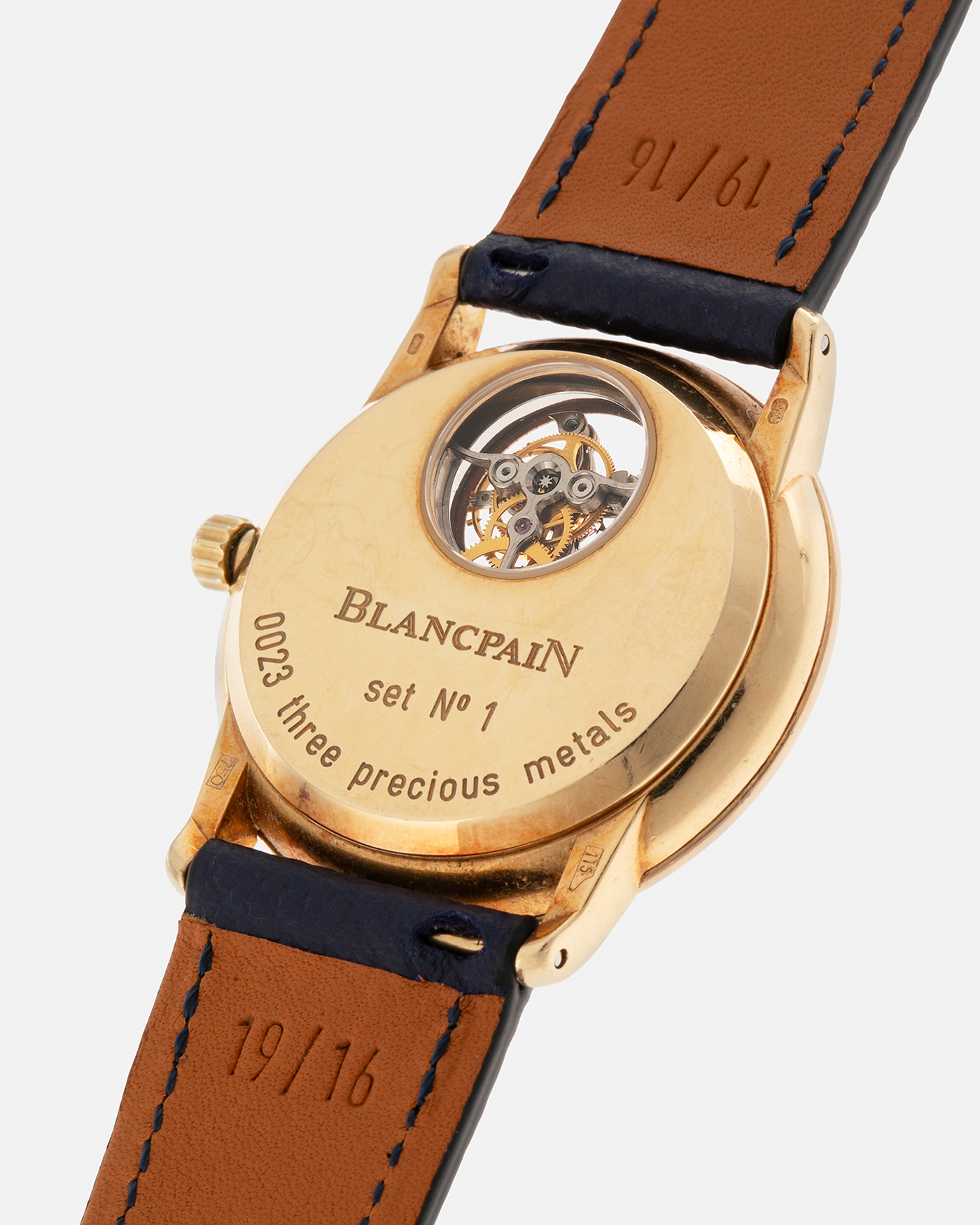 Brand: Blancpain
Year: 1996
Model: Villeret Flying Tourbillon 8 Days, Limited to 99 Pieces Across all Metals
Reference: 0023-1418-55
Material: 18-carat Yellow Gold
Movement: Blancpain Cal. 23, Manual-Winding Flying Tourbillon
Case Dimensions: 34mm x 7.4mm (Lug-to-Lug 40mm)
Lug Width: 19mm
Strap: Nostime Dark Navy Textured Calf Leather Strap with Signed 18-carat Tang Buckle, with extra used Blancpain Black Alligator Leather Strap