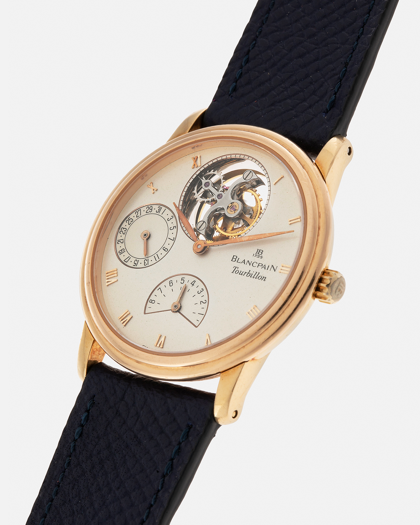 Brand: Blancpain
Year: 1996
Model: Villeret Flying Tourbillon 8 Days, Limited to 99 Pieces Across all Metals
Reference: 0023-1418-55
Material: 18-carat Yellow Gold
Movement: Blancpain Cal. 23, Manual-Winding Flying Tourbillon
Case Dimensions: 34mm x 7.4mm (Lug-to-Lug 40mm)
Lug Width: 19mm
Strap: Nostime Dark Navy Textured Calf Leather Strap with Signed 18-carat Tang Buckle, with extra used Blancpain Black Alligator Leather Strap
