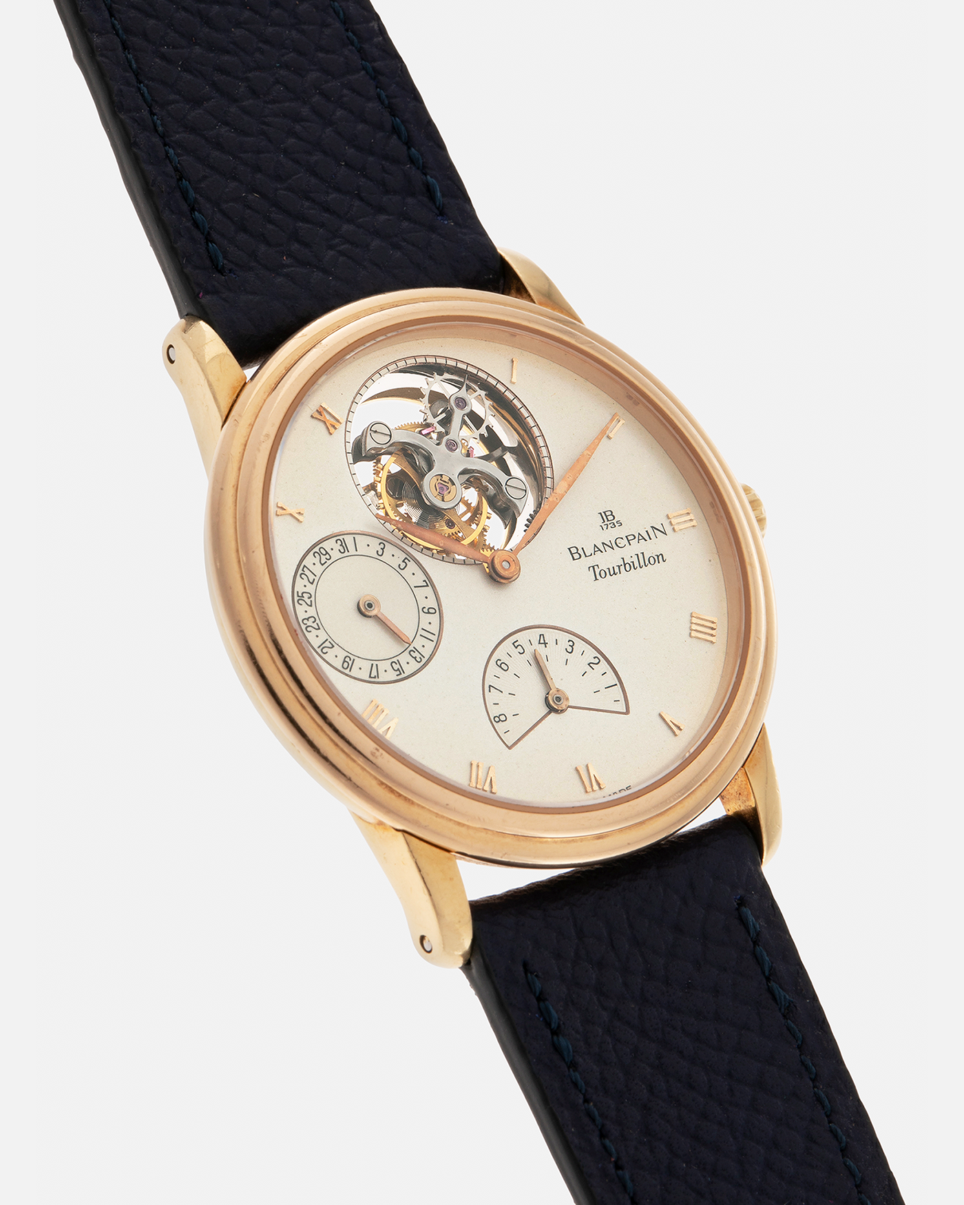 Brand: Blancpain
Year: 1996
Model: Villeret Flying Tourbillon 8 Days, Limited to 99 Pieces Across all Metals
Reference: 0023-1418-55
Material: 18-carat Yellow Gold
Movement: Blancpain Cal. 23, Manual-Winding Flying Tourbillon
Case Dimensions: 34mm x 7.4mm (Lug-to-Lug 40mm)
Lug Width: 19mm
Strap: Nostime Dark Navy Textured Calf Leather Strap with Signed 18-carat Tang Buckle, with extra used Blancpain Black Alligator Leather Strap