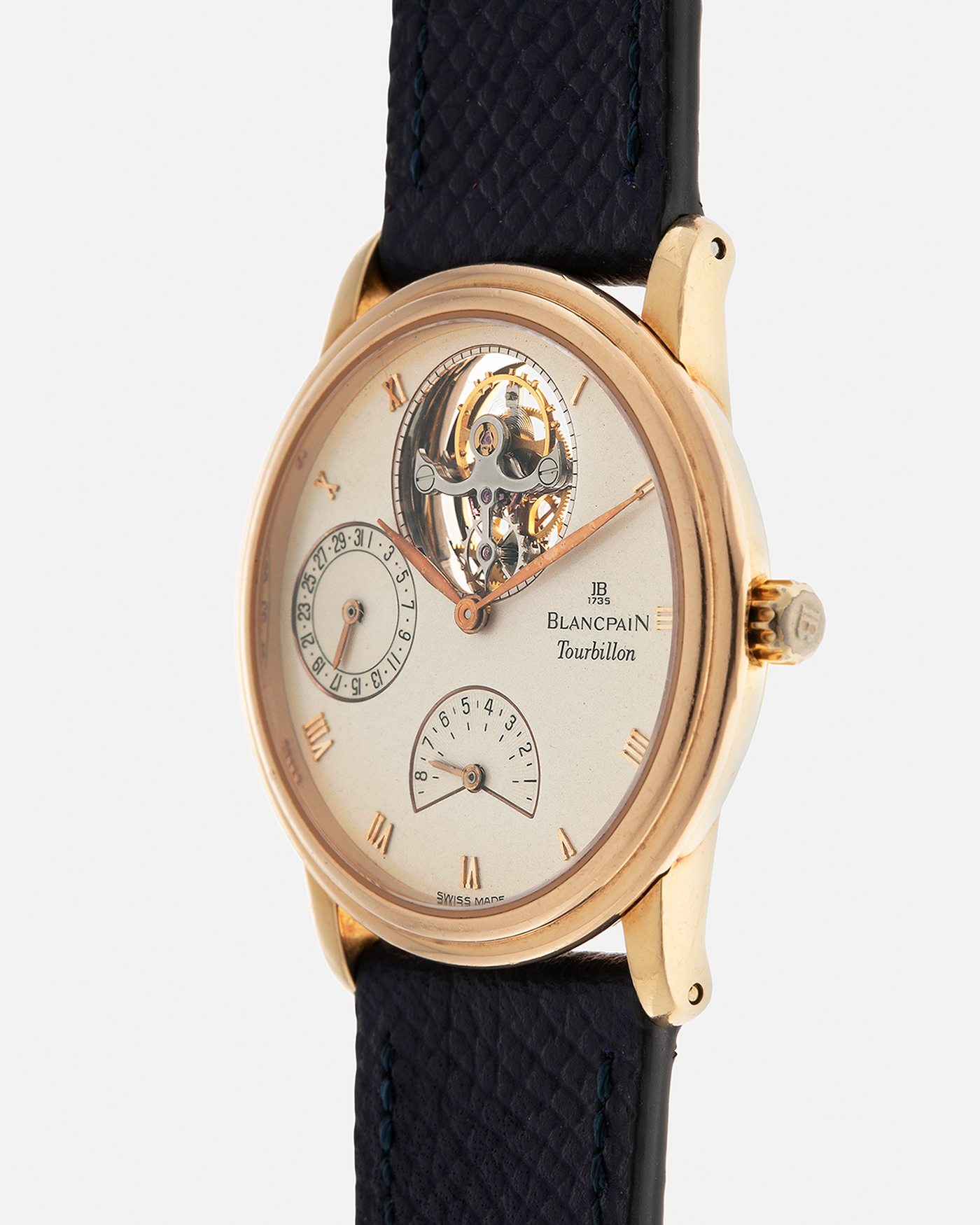 Brand: Blancpain
Year: 1996
Model: Villeret Flying Tourbillon 8 Days, Limited to 99 Pieces Across all Metals
Reference: 0023-1418-55
Material: 18-carat Yellow Gold
Movement: Blancpain Cal. 23, Manual-Winding Flying Tourbillon
Case Dimensions: 34mm x 7.4mm (Lug-to-Lug 40mm)
Lug Width: 19mm
Strap: Nostime Dark Navy Textured Calf Leather Strap with Signed 18-carat Tang Buckle, with extra used Blancpain Black Alligator Leather Strap