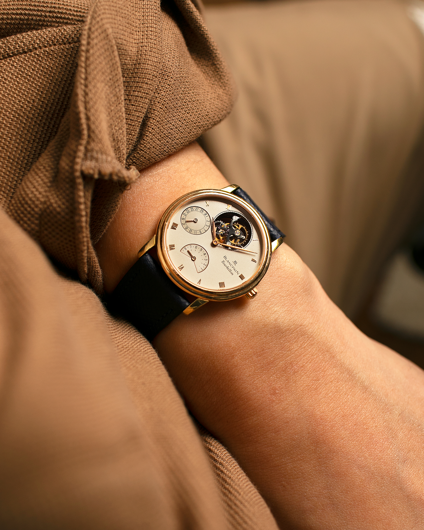 Brand: Blancpain
Year: 1996
Model: Villeret Flying Tourbillon 8 Days, Limited to 99 Pieces Across all Metals
Reference: 0023-1418-55
Material: 18-carat Yellow Gold
Movement: Blancpain Cal. 23, Manual-Winding Flying Tourbillon
Case Dimensions: 34mm x 7.4mm (Lug-to-Lug 40mm)
Lug Width: 19mm
Strap: Nostime Dark Navy Textured Calf Leather Strap with Signed 18-carat Tang Buckle, with extra used Blancpain Black Alligator Leather Strap