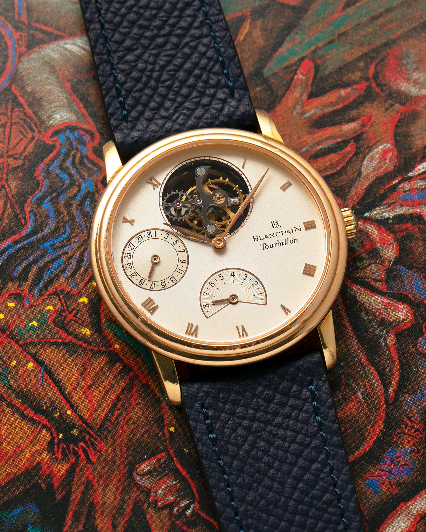 Brand: Blancpain
Year: 1996
Model: Villeret Flying Tourbillon 8 Days, Limited to 99 Pieces Across all Metals
Reference: 0023-1418-55
Material: 18-carat Yellow Gold
Movement: Blancpain Cal. 23, Manual-Winding Flying Tourbillon
Case Dimensions: 34mm x 7.4mm (Lug-to-Lug 40mm)
Lug Width: 19mm
Strap: Nostime Dark Navy Textured Calf Leather Strap with Signed 18-carat Tang Buckle, with extra used Blancpain Black Alligator Leather Strap